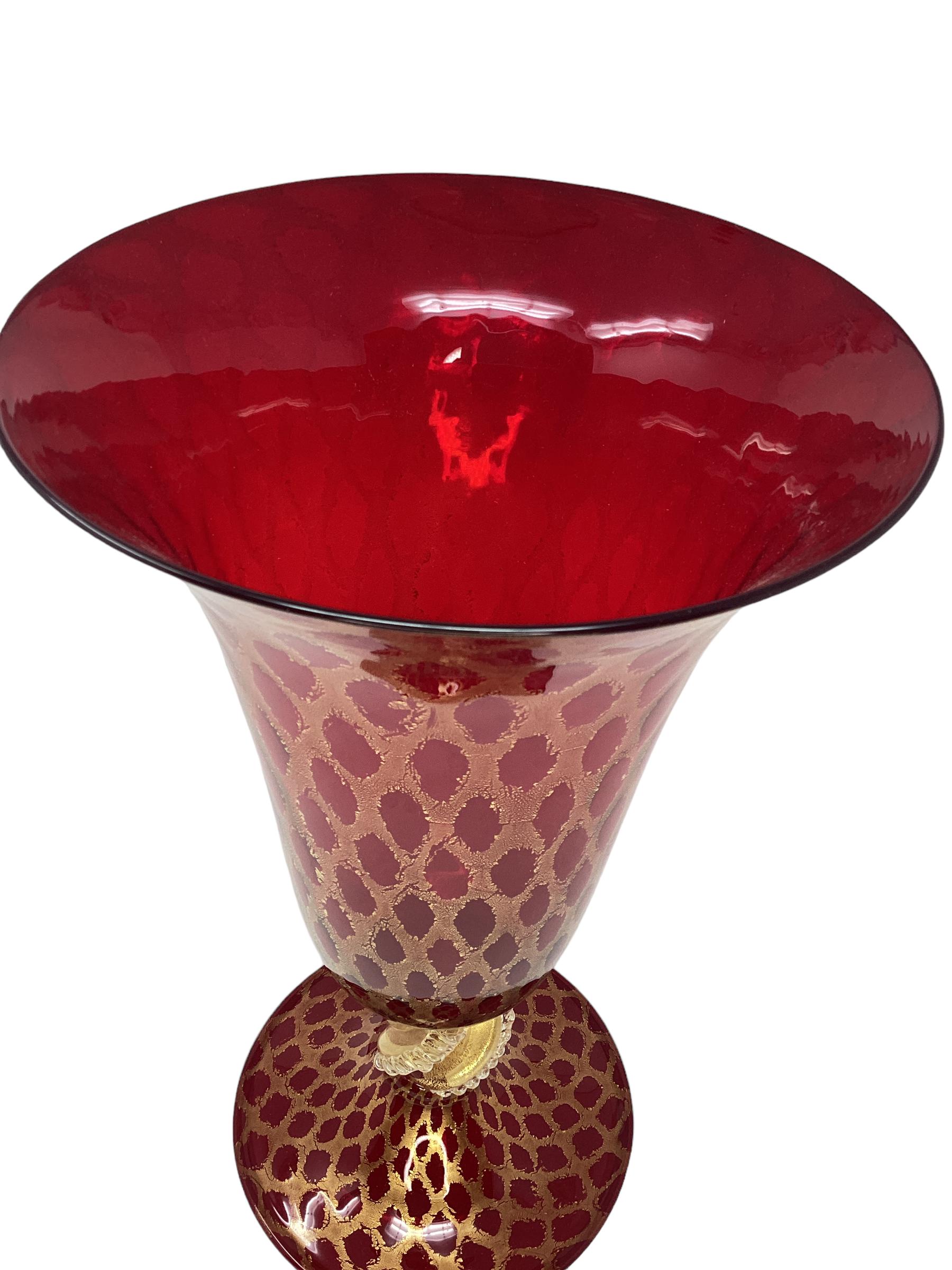 Gorgeous Vintage Trumpet Shaped Red Murano Glass Vase. Hand thrown vase profusely decorated with gold inclusions. In excellent vintage condition. 