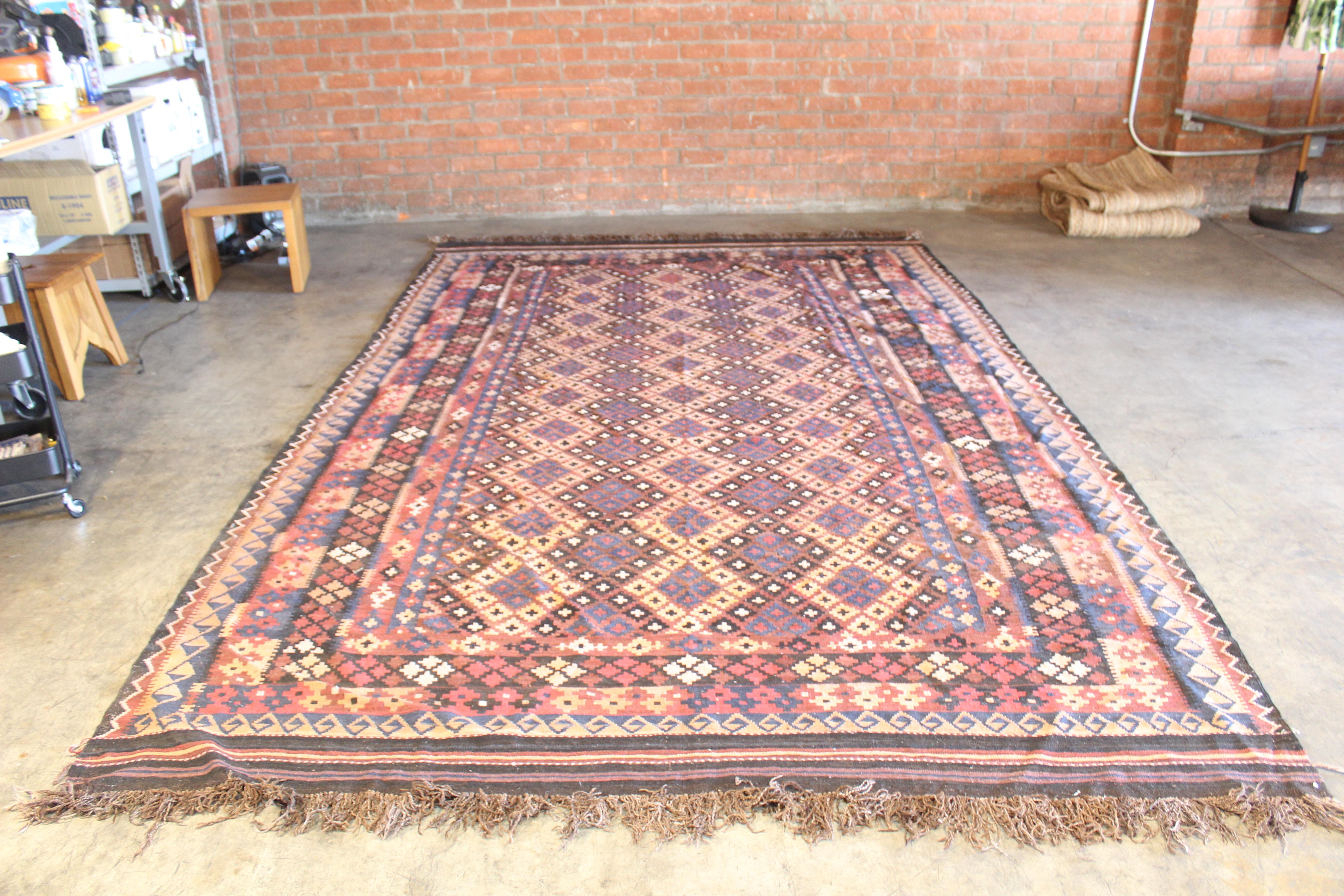 A large, room-sized, vintage 1960s Turkish flatweave wool kilim rug. In excellent condition, no stains, rips or tears.