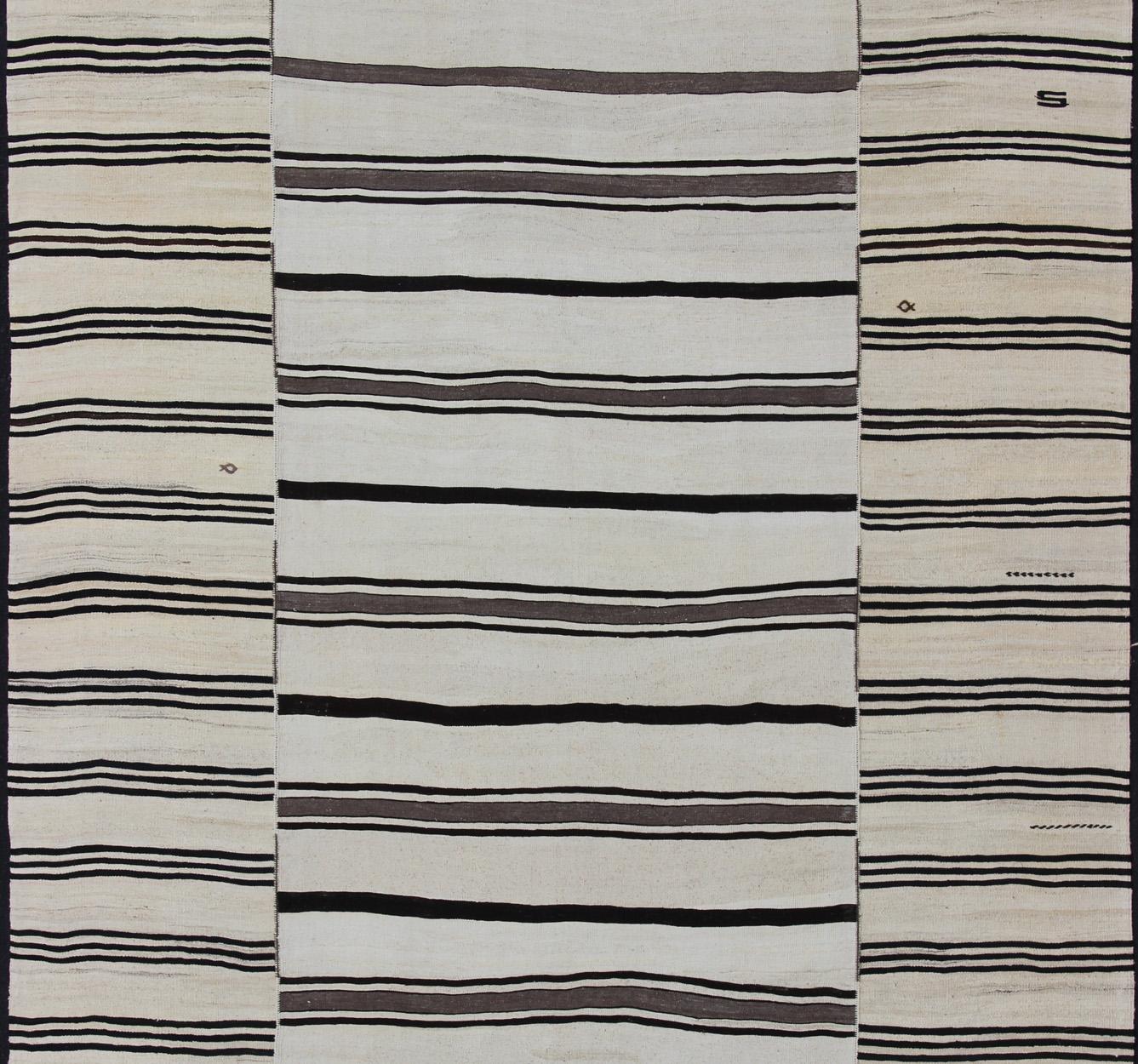 cream and black striped rug
