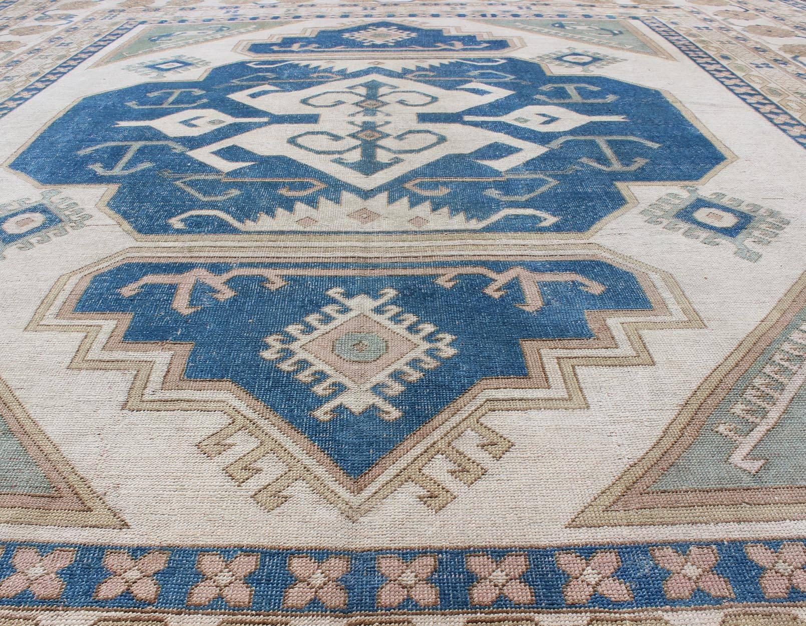 Oushak Large Vintage Turkish Rug with Stylized Geometric Design in Blue, Ivory, Tan For Sale