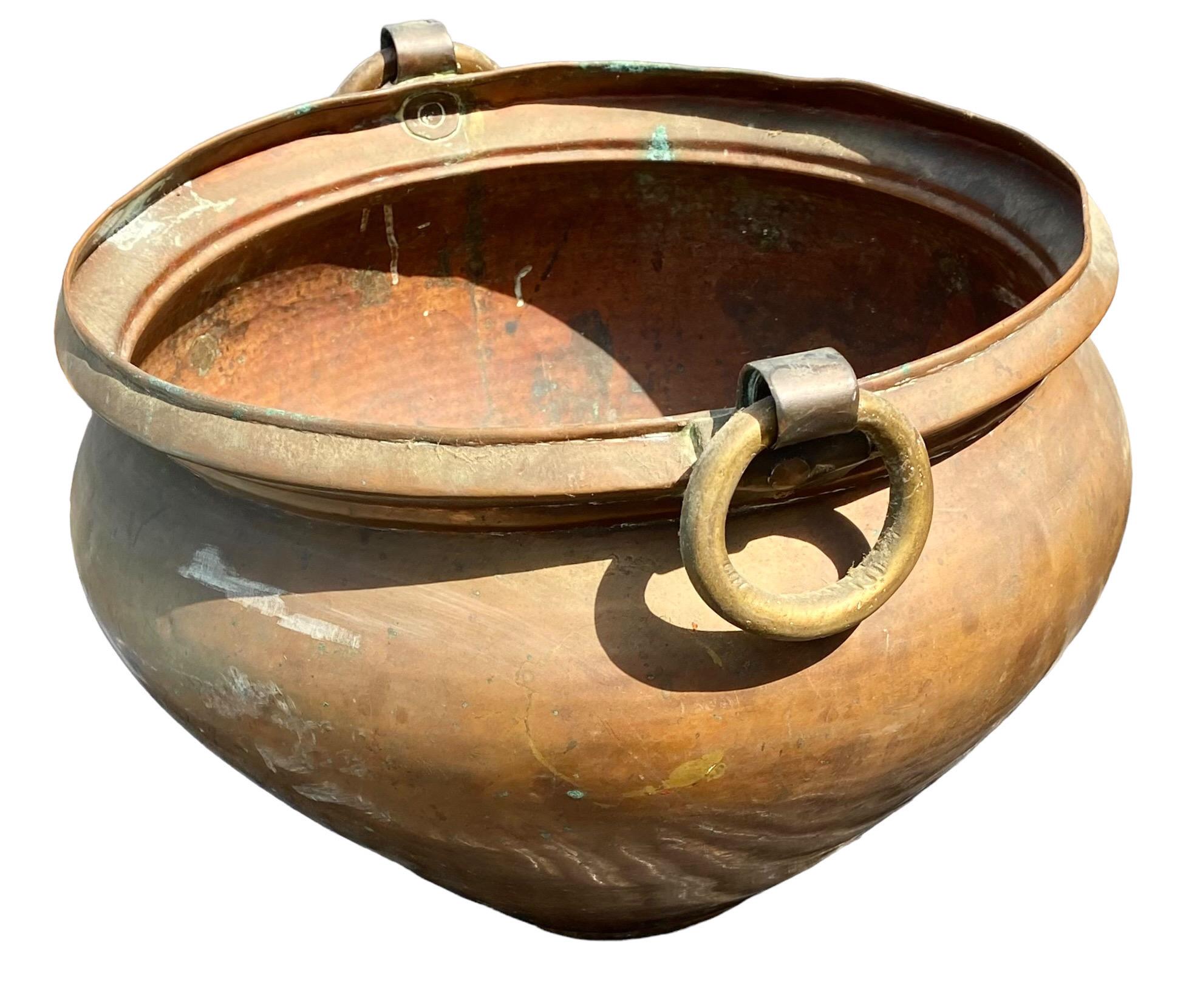 A 1950's-1960's handcrafted Turkish tribal, copper, iron and brass water pot. In original condition, non-altered with an old outstanding patina and color. Beautiful Verdi-Gris in the bottom interior. Heavy and solid.