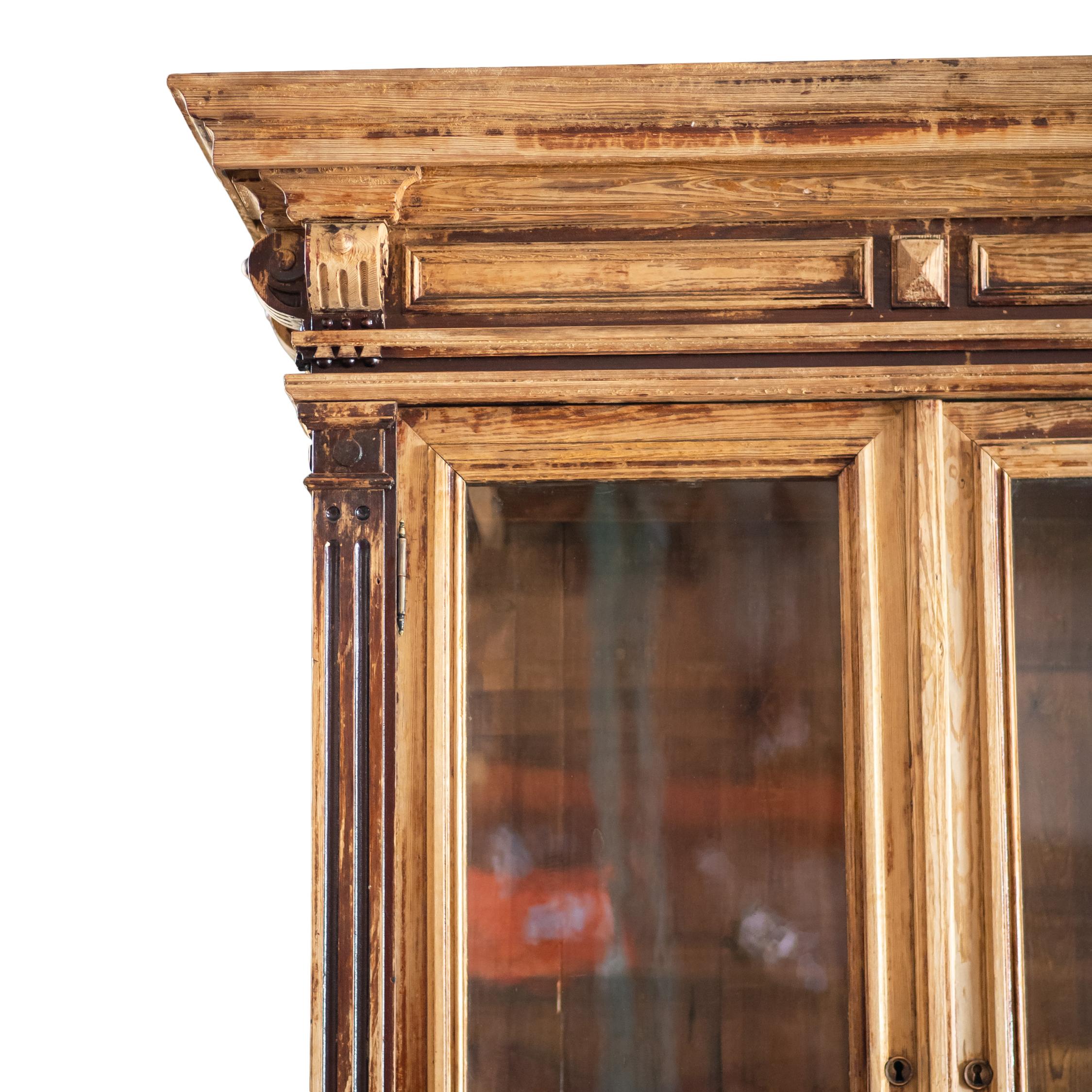 This large vintage two-piece wood cabinet is a true statement piece. With its classic design and generous scale, it brings warmth, charm, and functionality to any space.

The upper section features glass-front doors—perfect for displaying books,