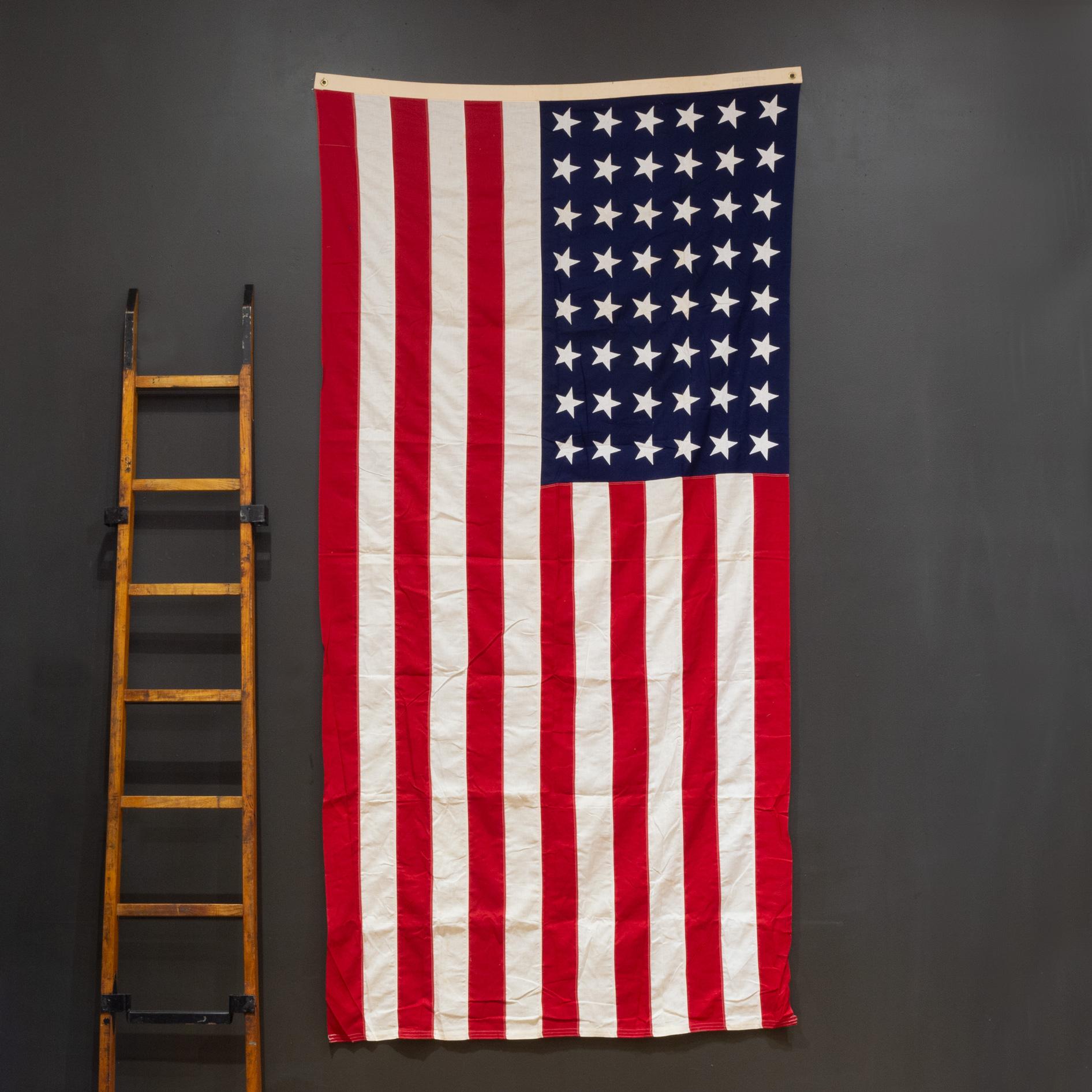 ABOUT

A large Valley Forge American flag made with 48 hand sewn stars and stripes. It is in good condition and has brass grommets to hang.

    CREATOR Valley Forge.
    DATE OF MANUFACTURE c.1940-1950.
    MATERIALS AND TECHNIQUES Cotton, Brass.
 
