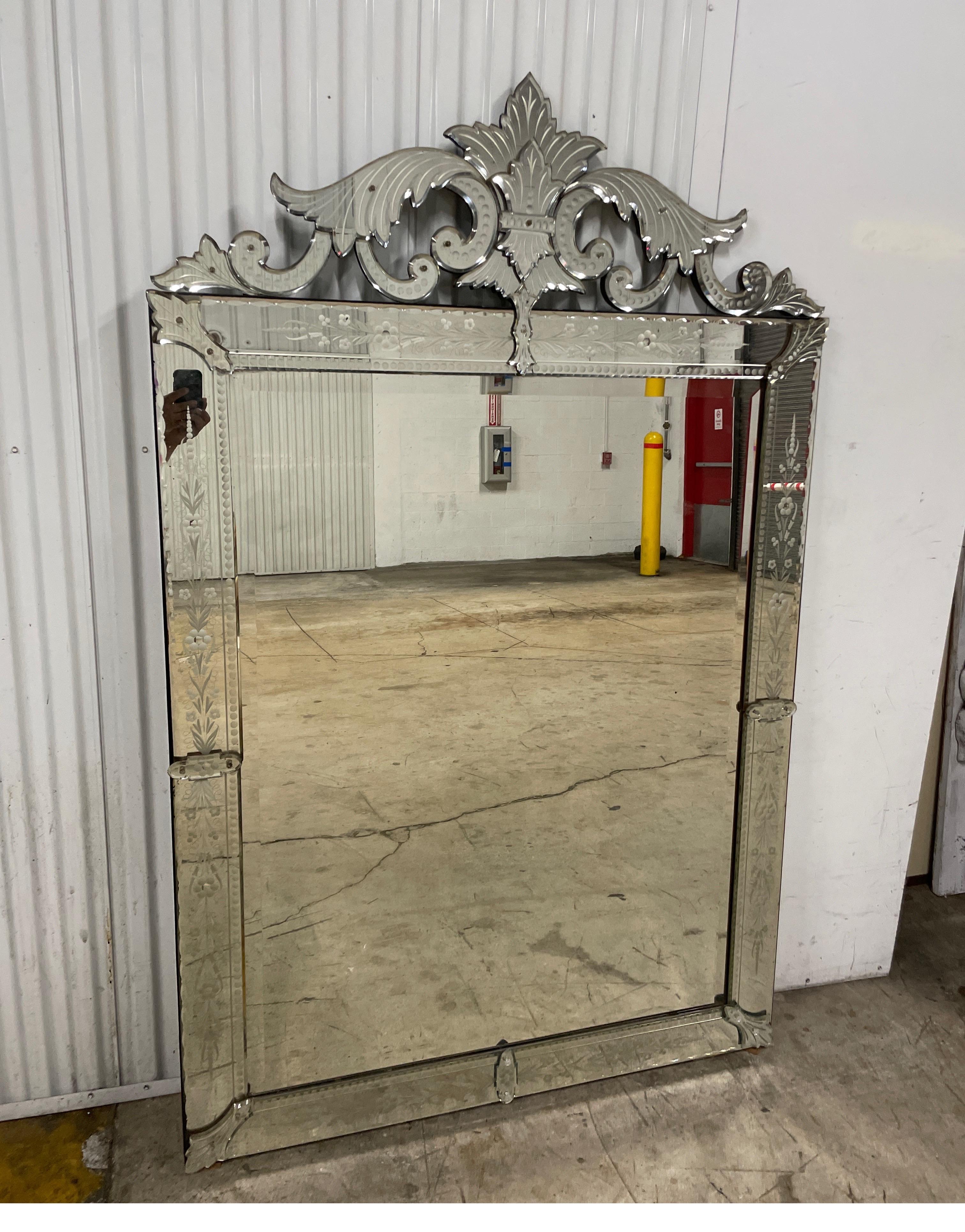 Large & elegant vintage Venetian mirror. The image really says it all. it is very stately and a true classic.  Will certainly add glamour to any setting.
