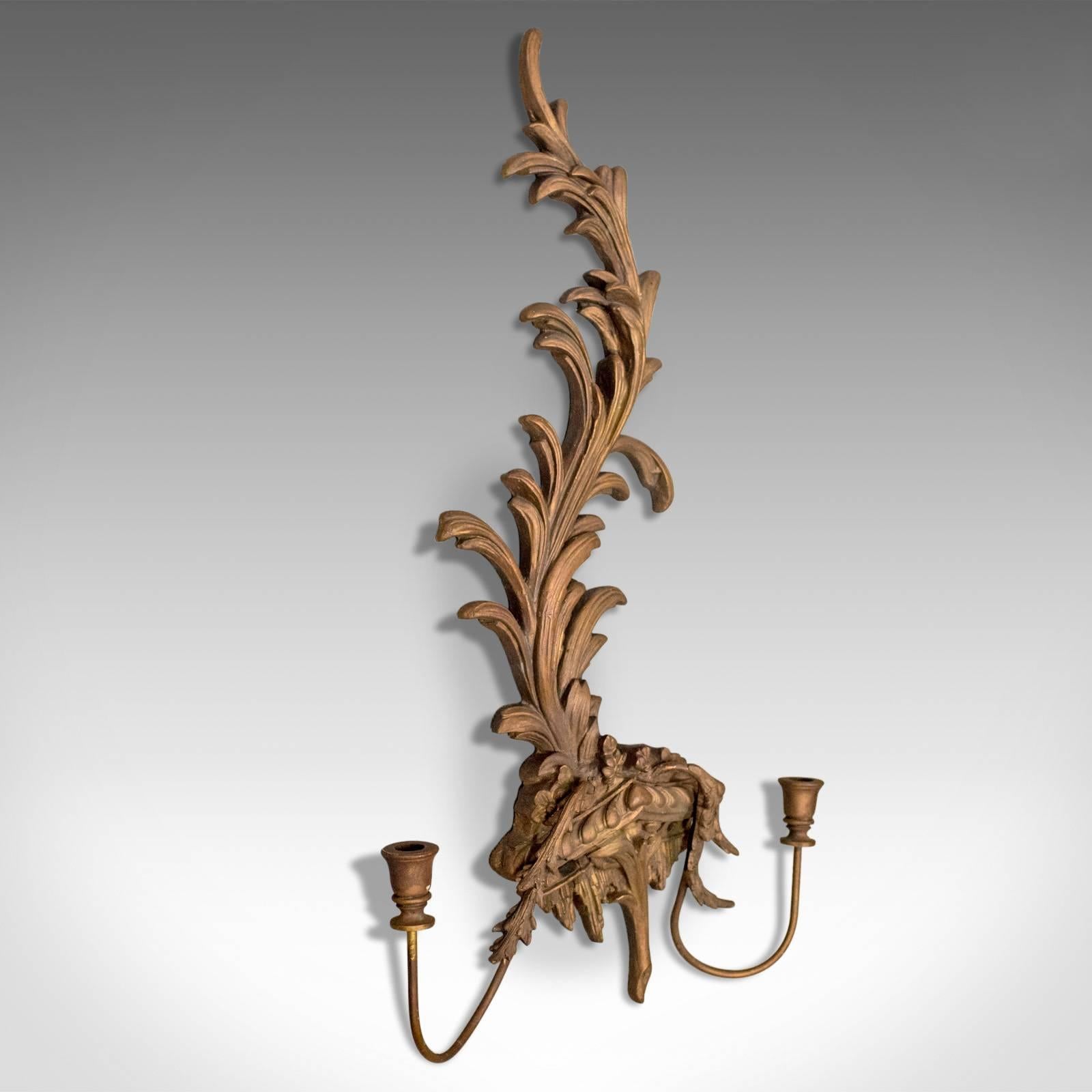 This is a large vintage wall sconce, a 20th century, Rococo revival, girandole candle stand.

Long and sinuous foliate form
Attractive wall hanging candle sconce
Of natural form finished in a golden lustre
Twin candle branches
Easily mounted