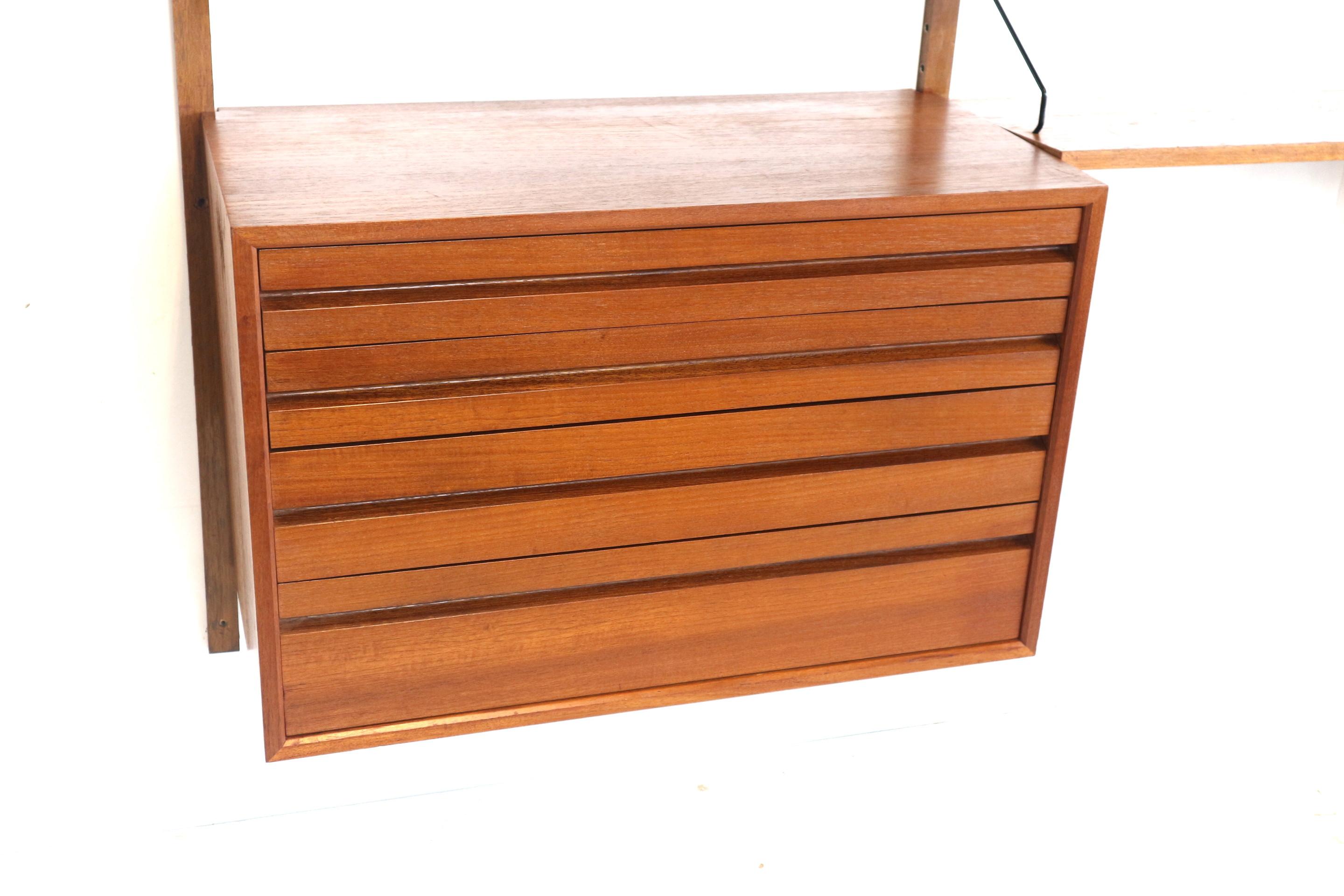 Large vintage wall system by Poul Cadovius made in the 1960s.

Dimensions:
Width: 243 cm
Height: 202 cm
Depth: 40 cm

Valve box:
Width: 80 cm
Depth: 37.5 cm
Height: 42.5 cm

Chest of drawers:
Width: 80 cm
Depth: 40 cm
Height: 52 cm

Depth shelves: