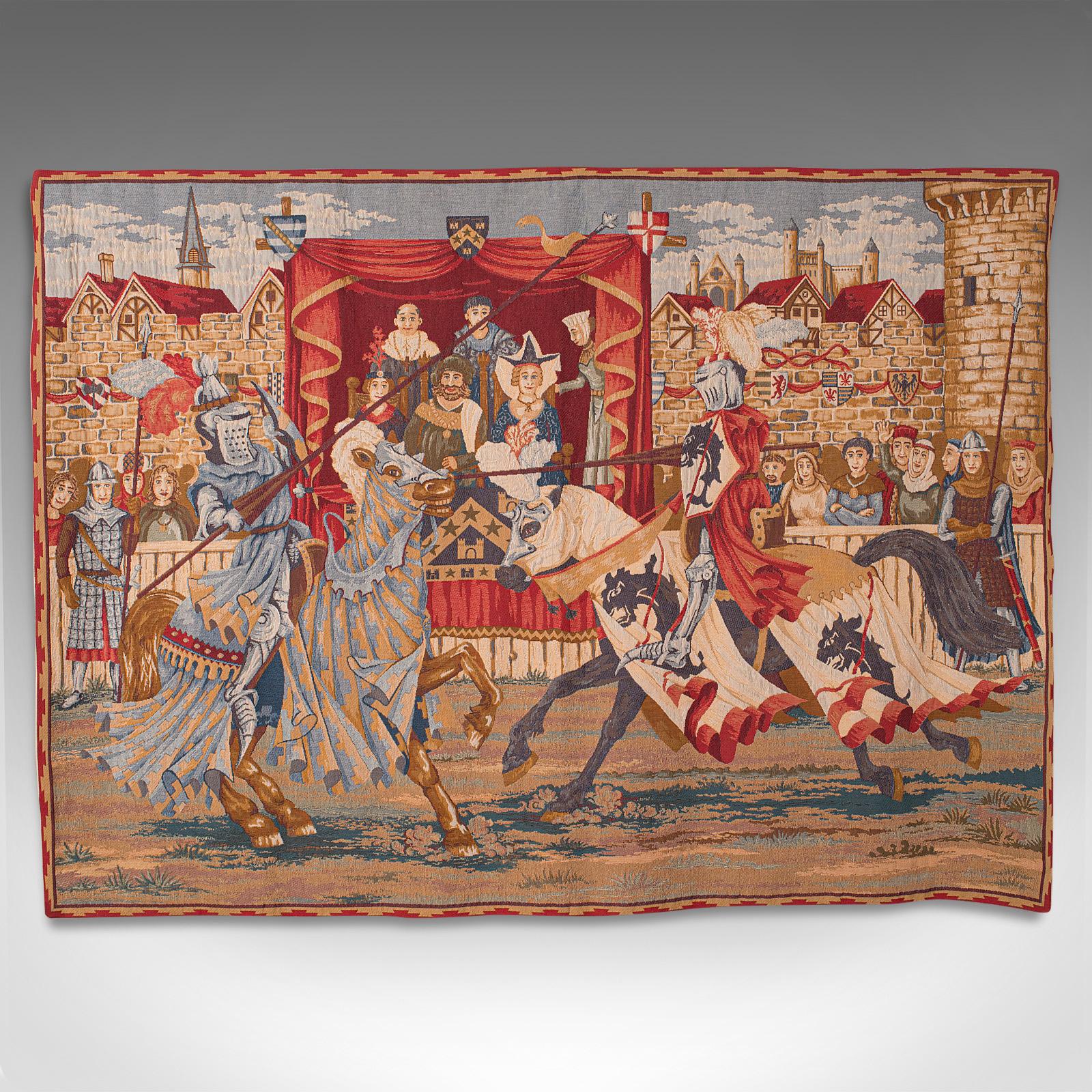 This is a large vintage wall tapestry. A French, quality needlepoint display panel depicting a Medieval tournament scene, dating to the late 20th century.

Colourful tapestry of impressive proportion and fine quality
Displays a desirable aged