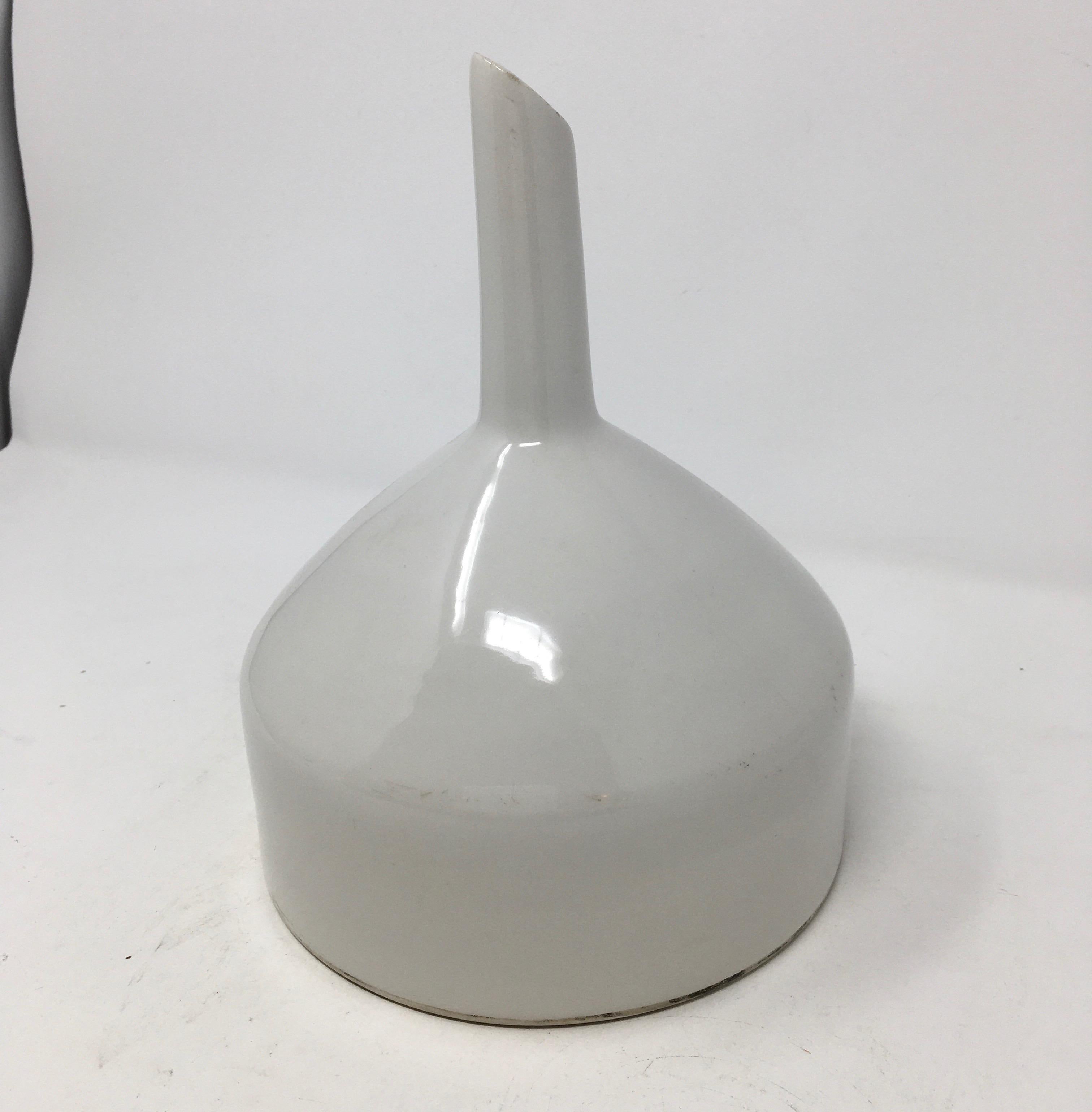 Found in France, this white ironstone or funnel marked G.D.V. was originally used in a pharmacy or laboratory. Made in the early 20th century. By Girault-Demay-Vignolet, the funnel/sieve was used for filtering while pouring into a bottle. The white