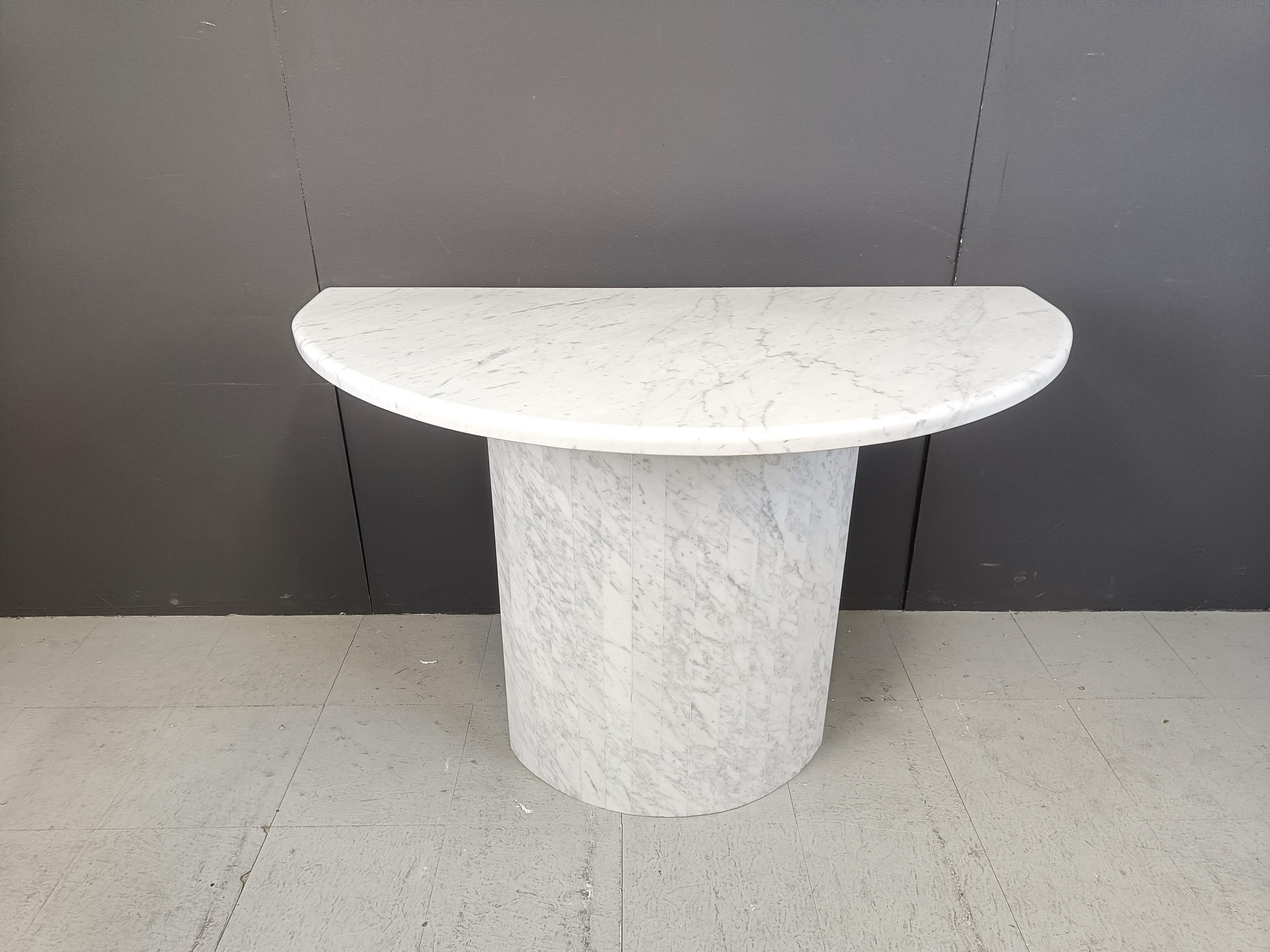 Elegant half round white marble console table.

Timeless piece which matches all interiors.

1970s - Italy

overall good condition.

Dimensions:
Height: 85cm
Width: 120cm
Depth: 60cm

Ref.: 24112604

*All images are always part of the description