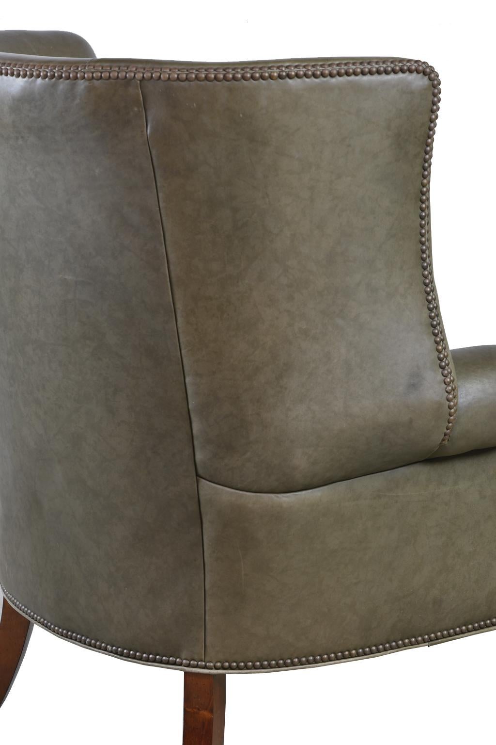 Carved Large Vintage Wingback Armchair with Sage-Green Leather Upholstery