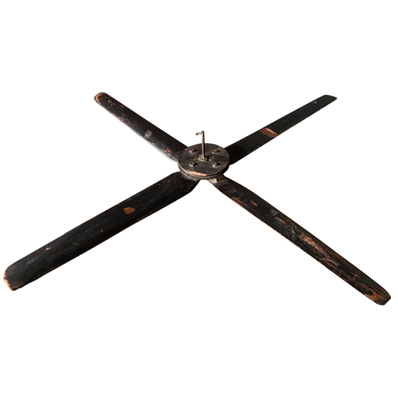 Large French black-painted wooden ceiling fan.