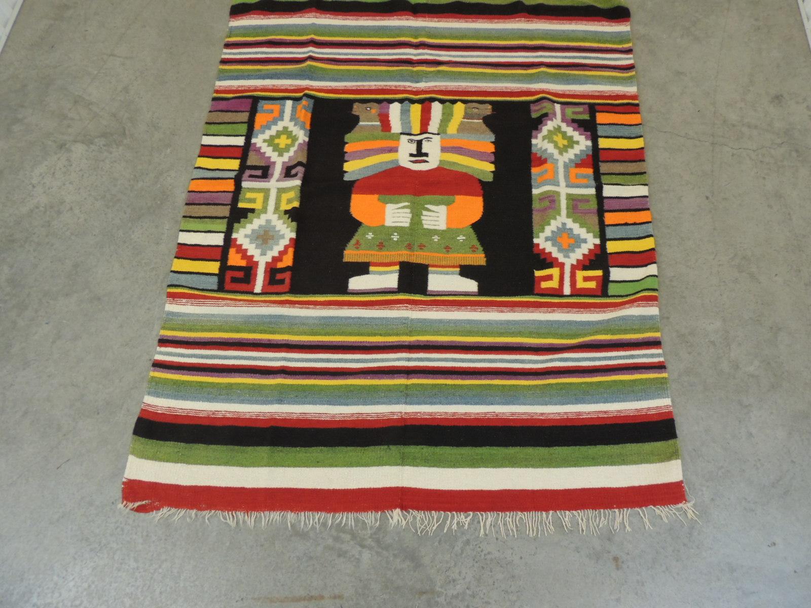 Large vintage Peruvian warrior throw with colorful stripes.
Large enough to use as a blanket on a twin bed.
In shades of orange, green, red and black.
Hand-twisted fringes on both sides. Reversible.
Size: 52