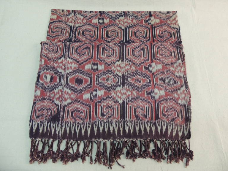 Large tribal pattern textile Ikat panel with hand knotted fringes in shades of black, brown, read and white.
The fabric is weaved not printed.
Ideal for a sofa, bed, club chair or bed.
Size: 48