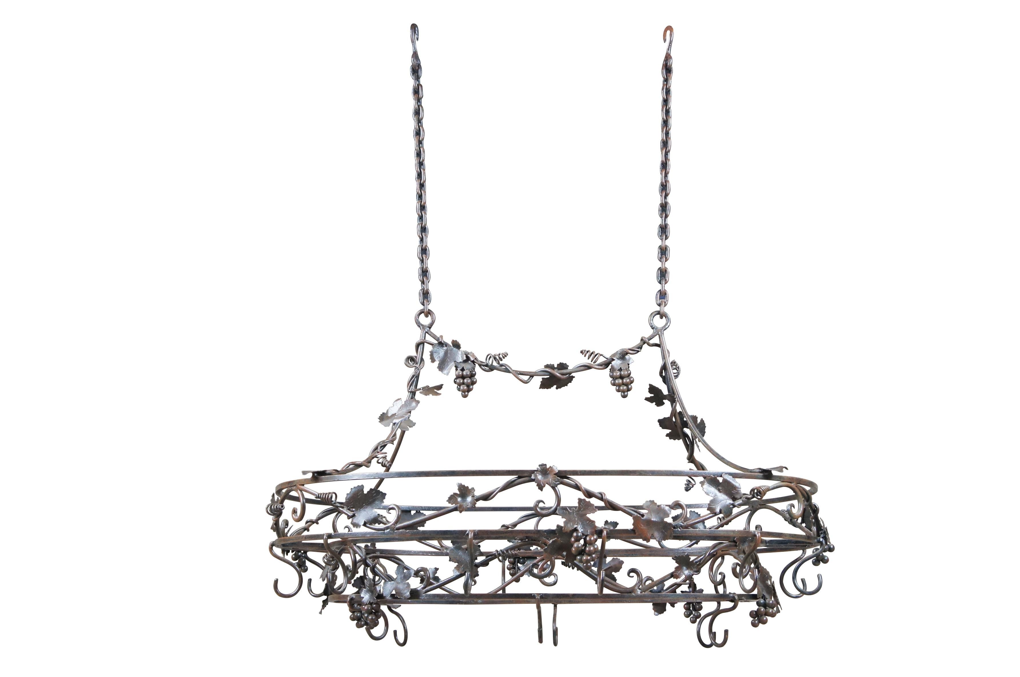 Late 20th century wrought iron pot rack featuring Tuscan grapevine and leaf / wine / Vineyard theme with stunning detail.  Made in the Philippines. 

Dimensions:
52