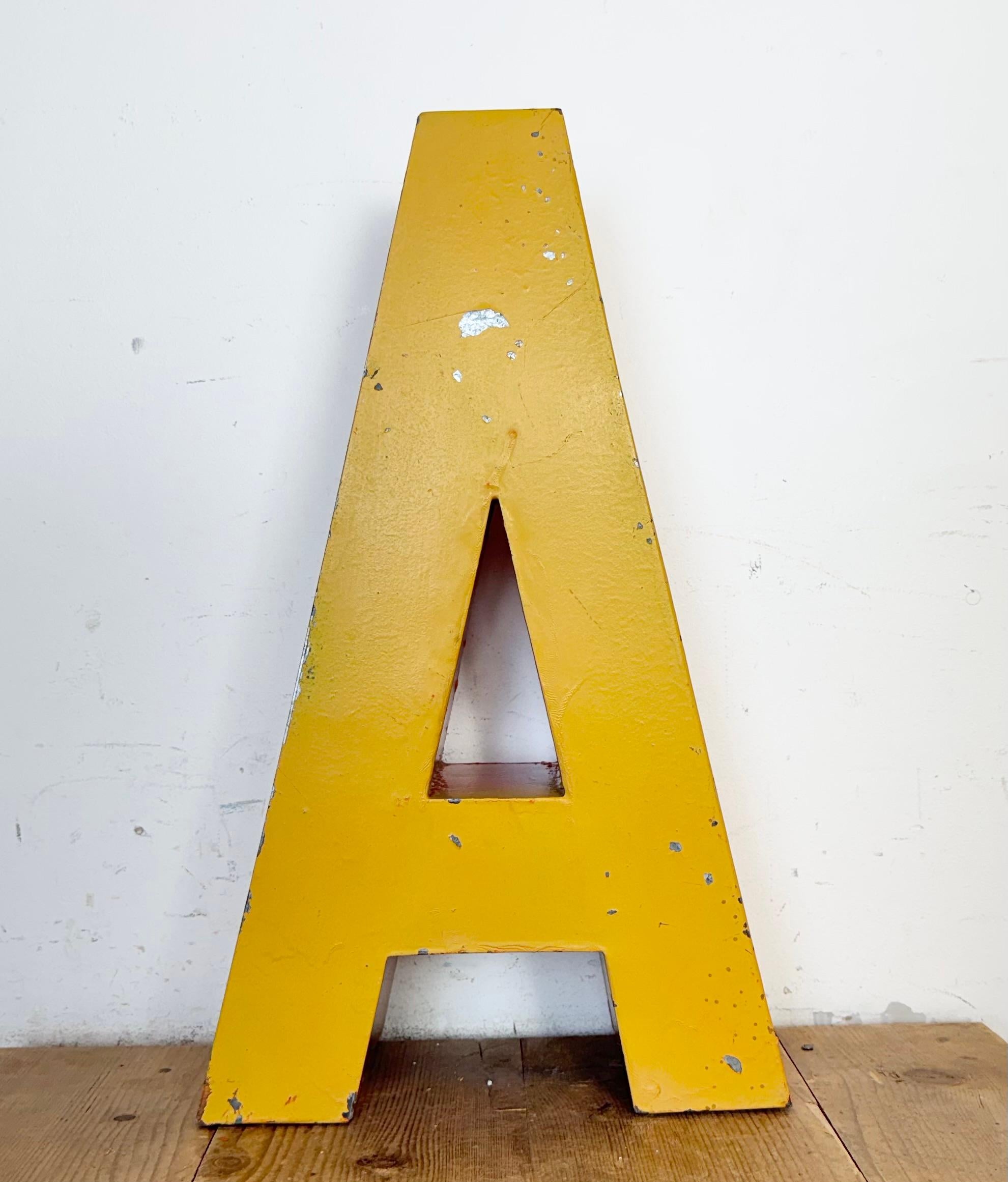 This vintage industrial facade letter “A” was made during the 1960s  in former Czechoslovakia and comes from an old inscription POŠTA. In czech language Post Office. The weight of the letter is 5,2 kg.