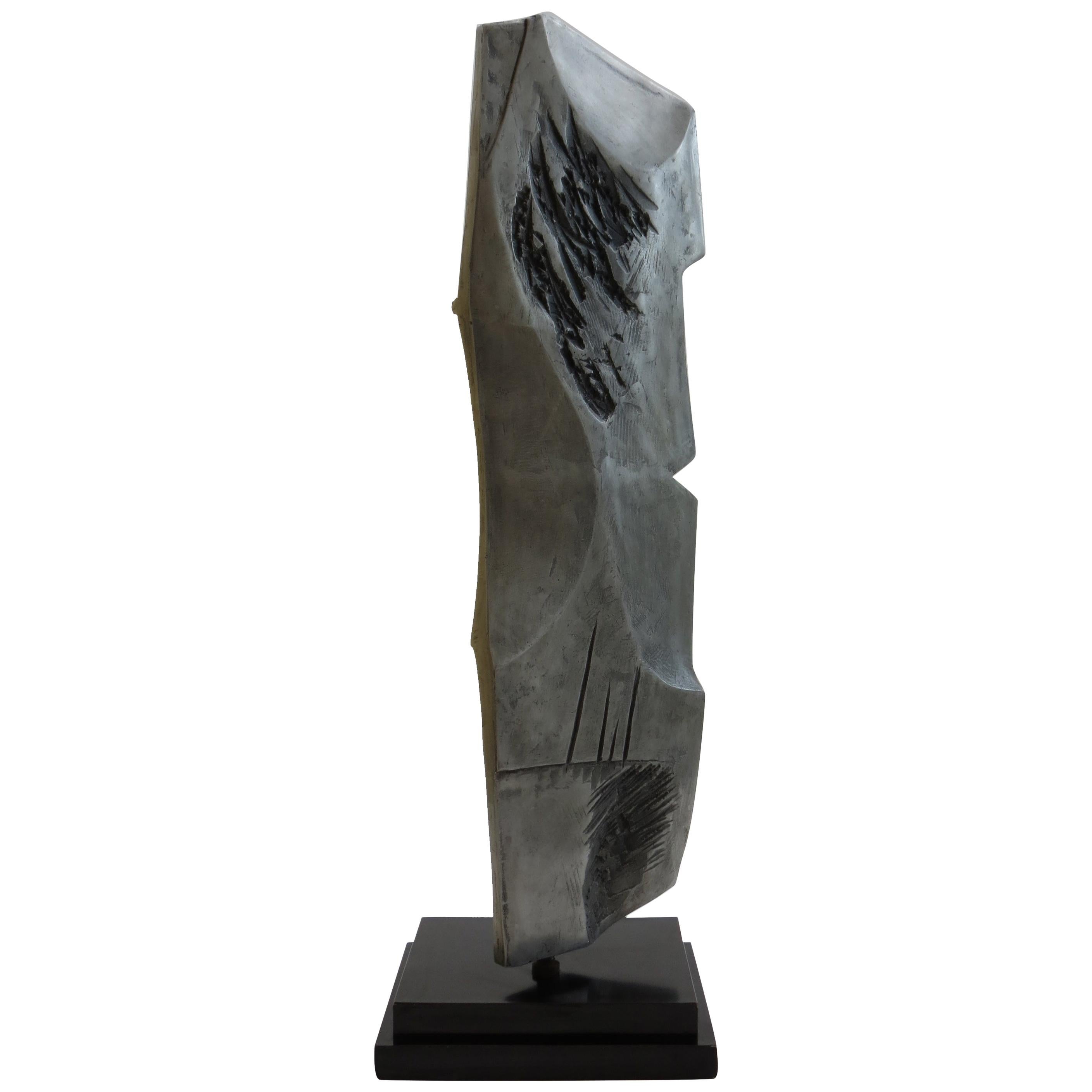 A very impressive floor standing abstract sculpture titled Blade I, circa 1970s.

Made from cast aluminium with laminate base. With a textured and smooth finish to both sides. The ‘blade’ can be rotated on a steel centre pivot to adjust the