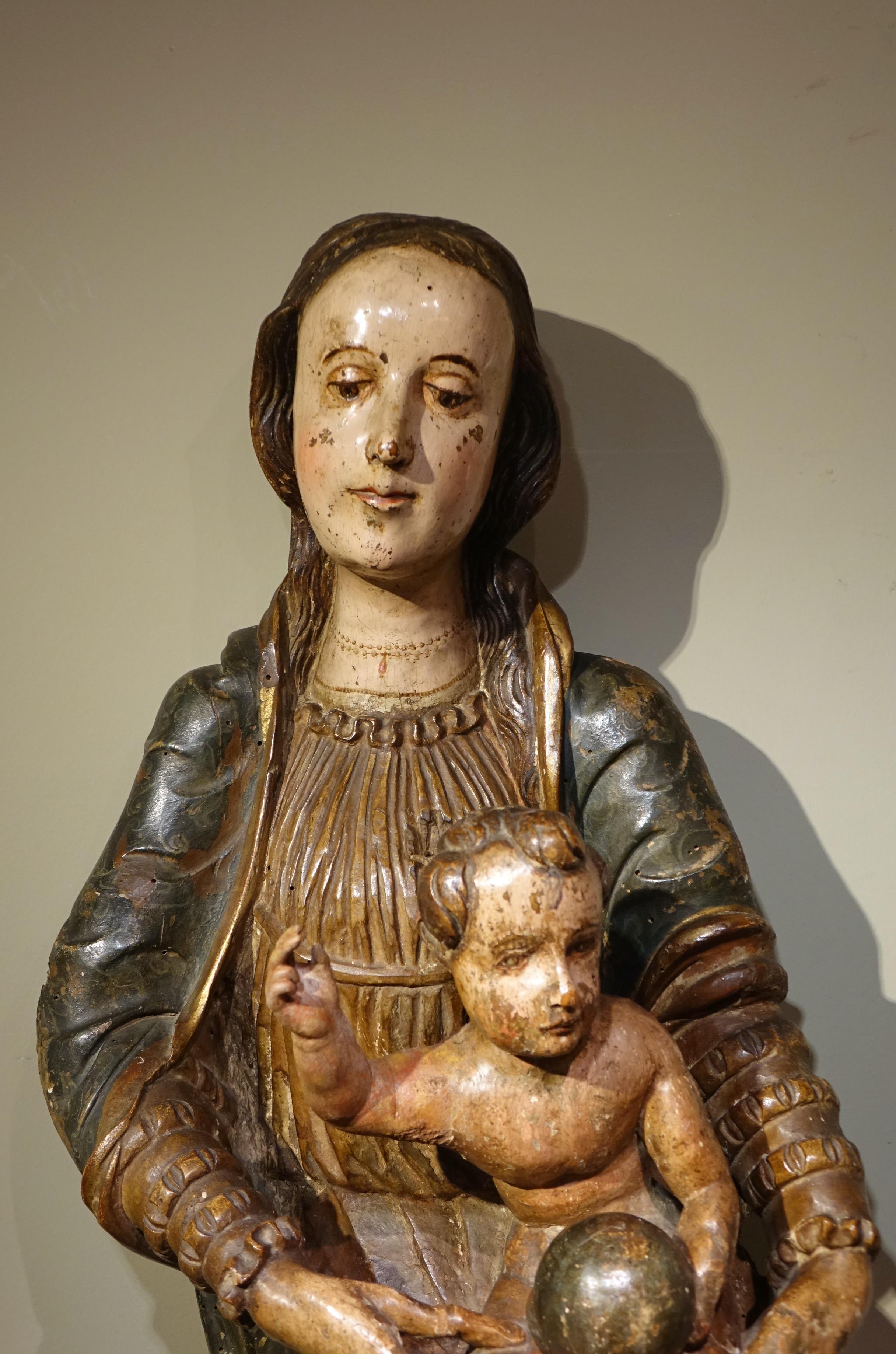 Large painted and carved wooden Virgin and Child in the round, representing the Virgin and Child carrying the globe.
The theme of the Virgin and Child is the most represented in all Christian art, whereas the infancy of Jesus is almost completely