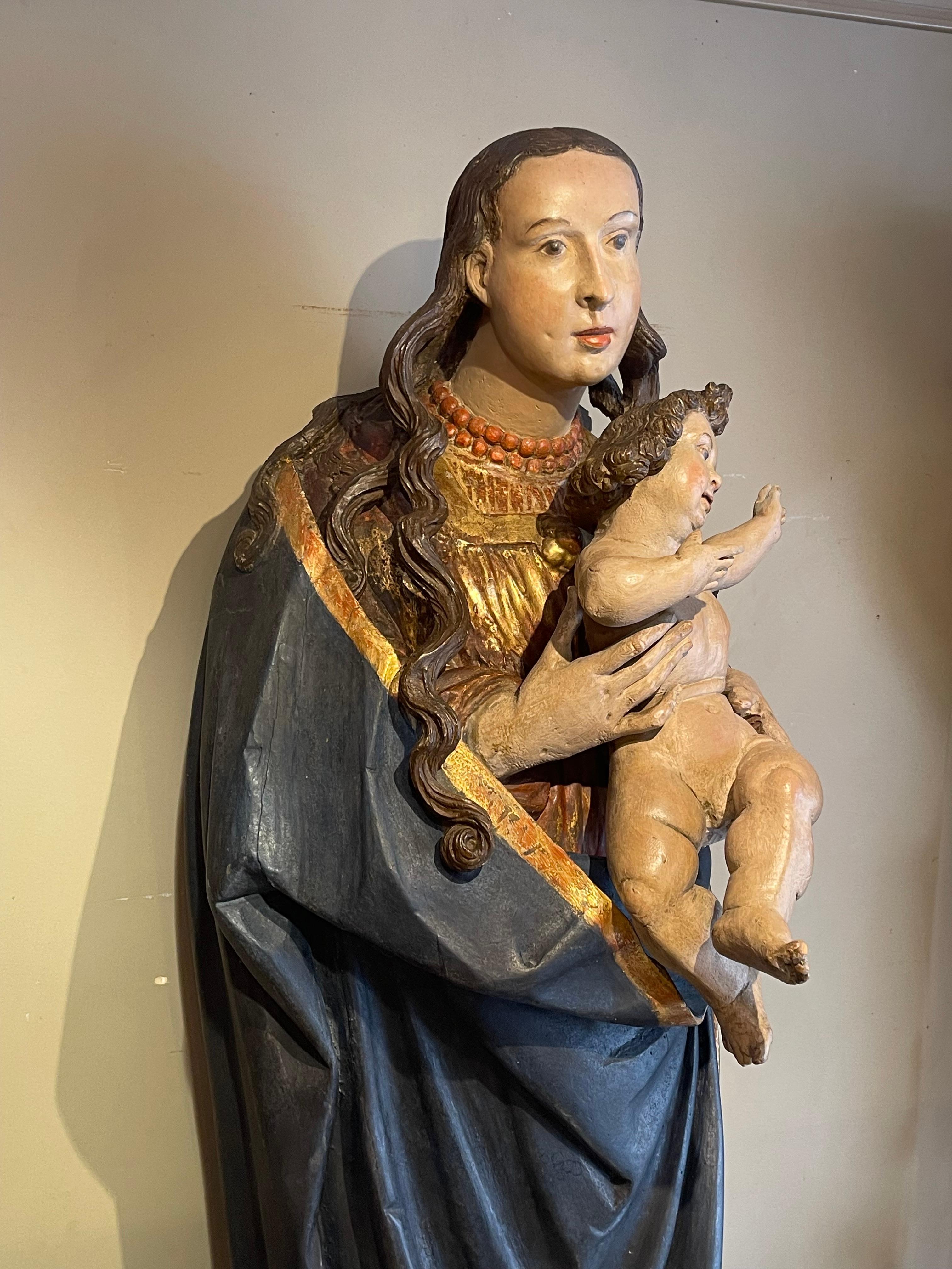 Large wooden Madonna and Child, painted and carved in hollow at the back.
The theme of the Virgin and Child is the most represented in all Christian art, whereas the infancy of Jesus is almost completely avoided by the canonical evangelists. This