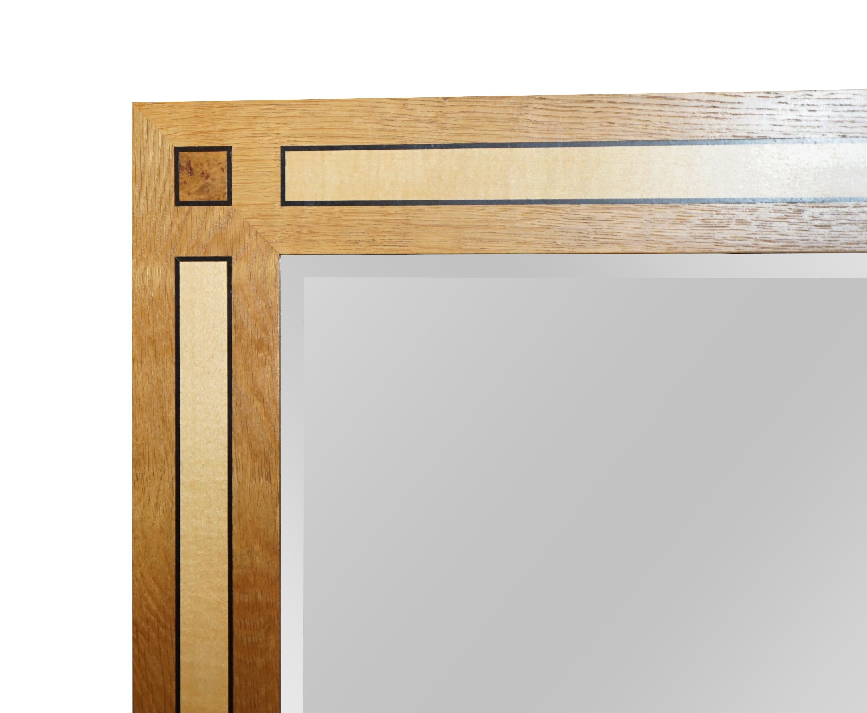 We are delighted to offer this absolutely exquisite original stamped Viscount David Linley overmantel wall mirror in Sycamore, burr walnut and satinwood

The mirror truly is impressive, it weighs an absolute tonne, it must be 80kgs, the bevelled