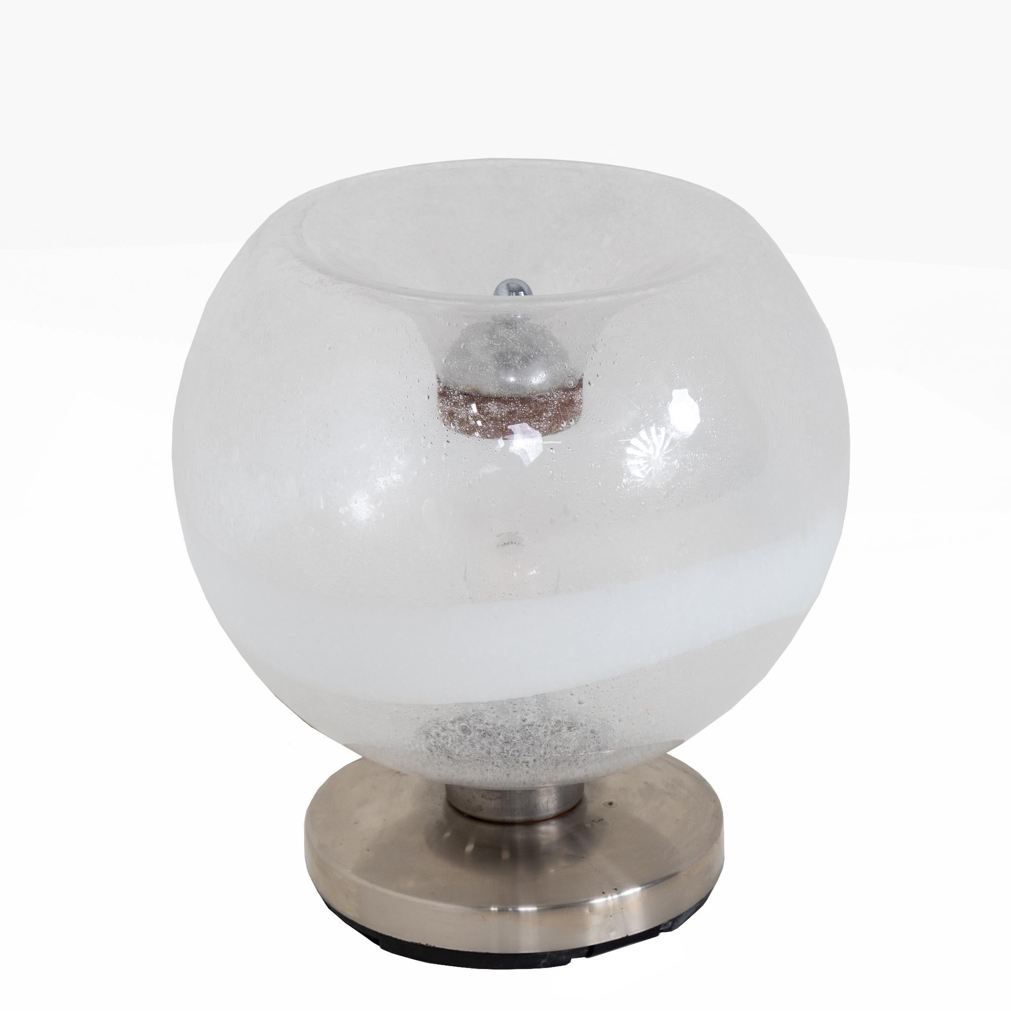 A large Vistosi glass table lamp. 
Clear glass with air bubble details, nickel base and details.