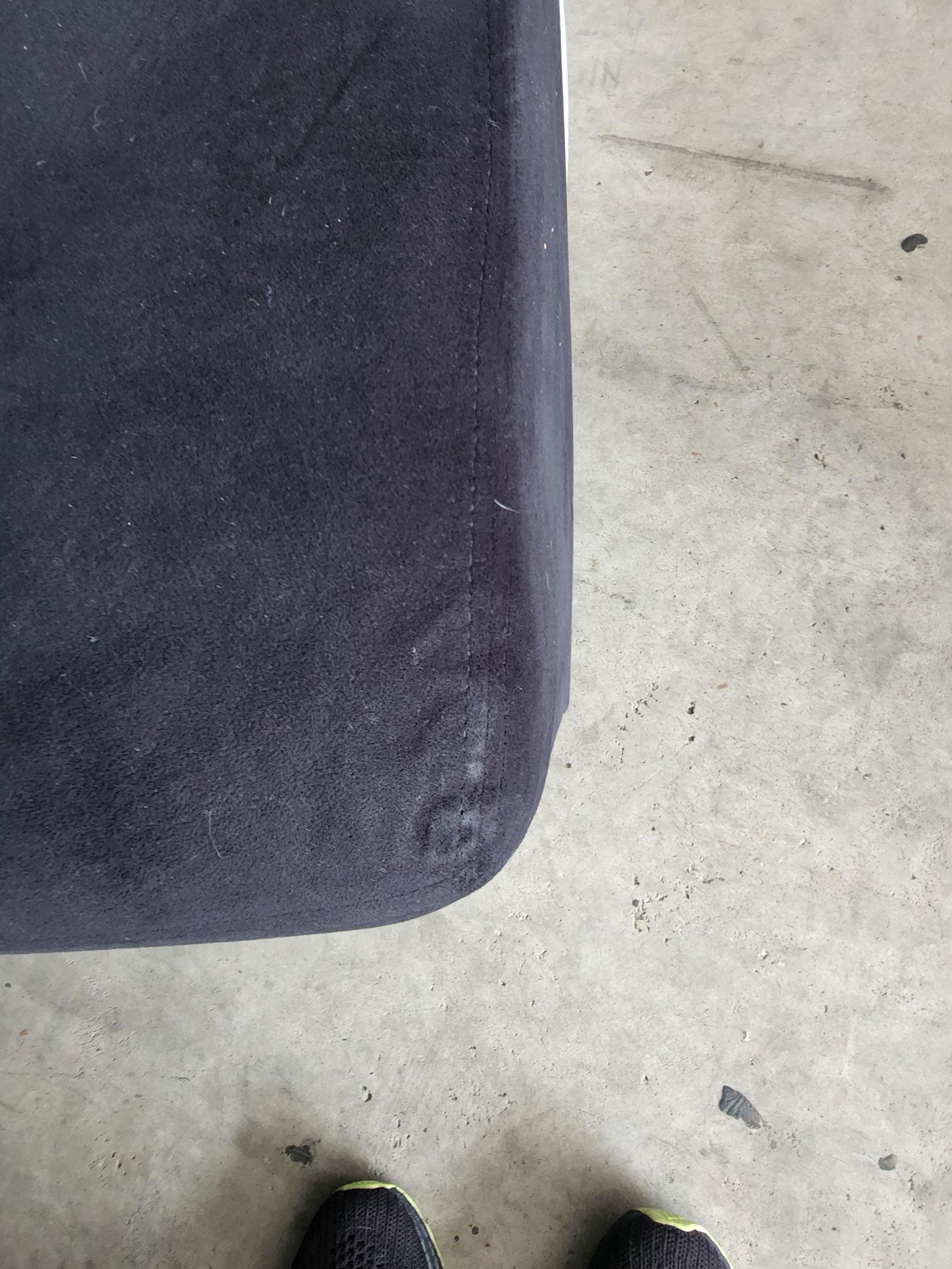 This is a dramatic Bilbao sofa designed by Vladimir Kagan was made by Preview. Sofa is five sections. The seat is upholstered in black micro-fiber and the back is a gray weave.