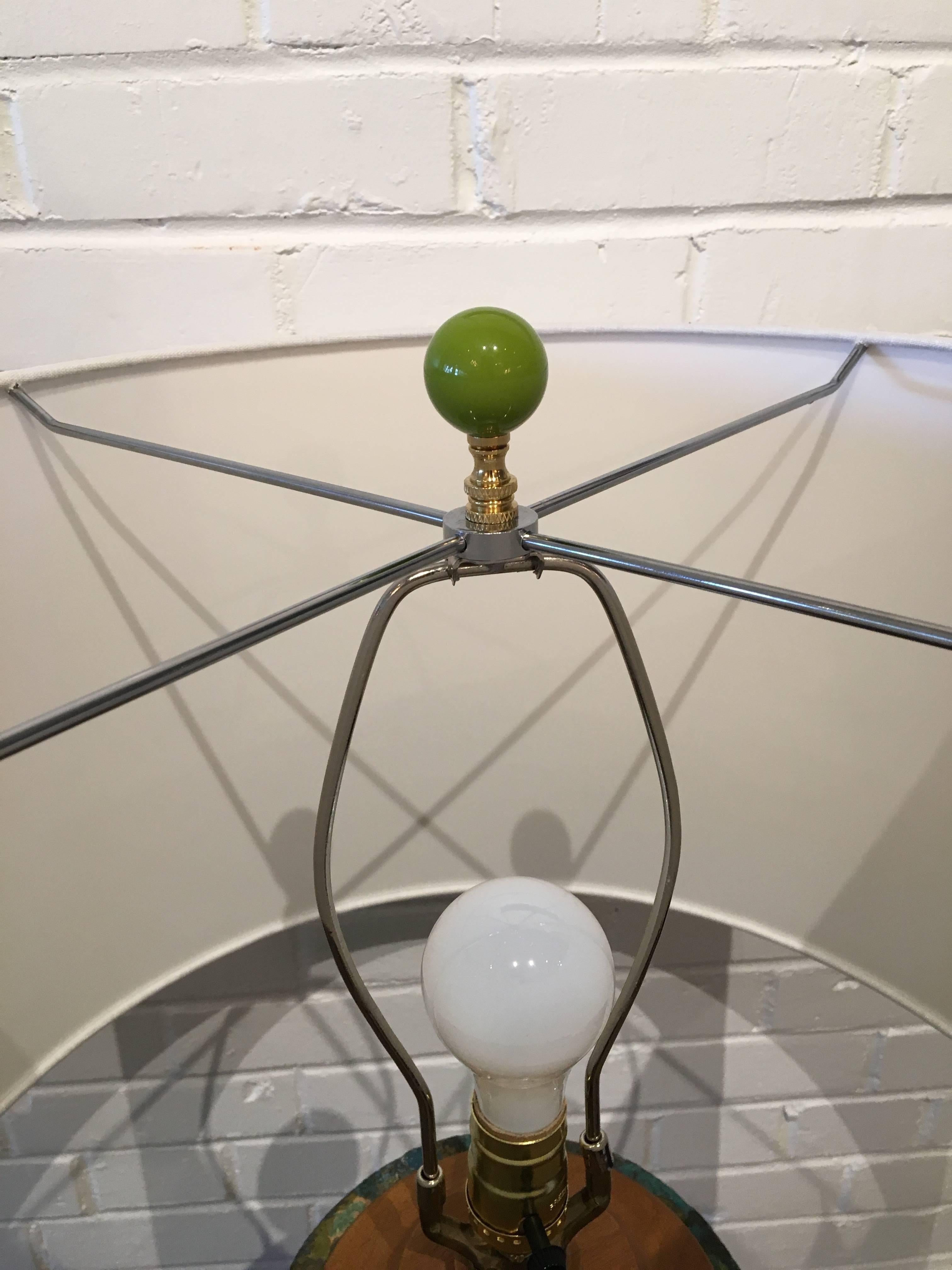 This oversized vintage lamp has an amazing texture and vavavoom presence! The lamp has been newly rewired with a new shade and final added. Wooden base.