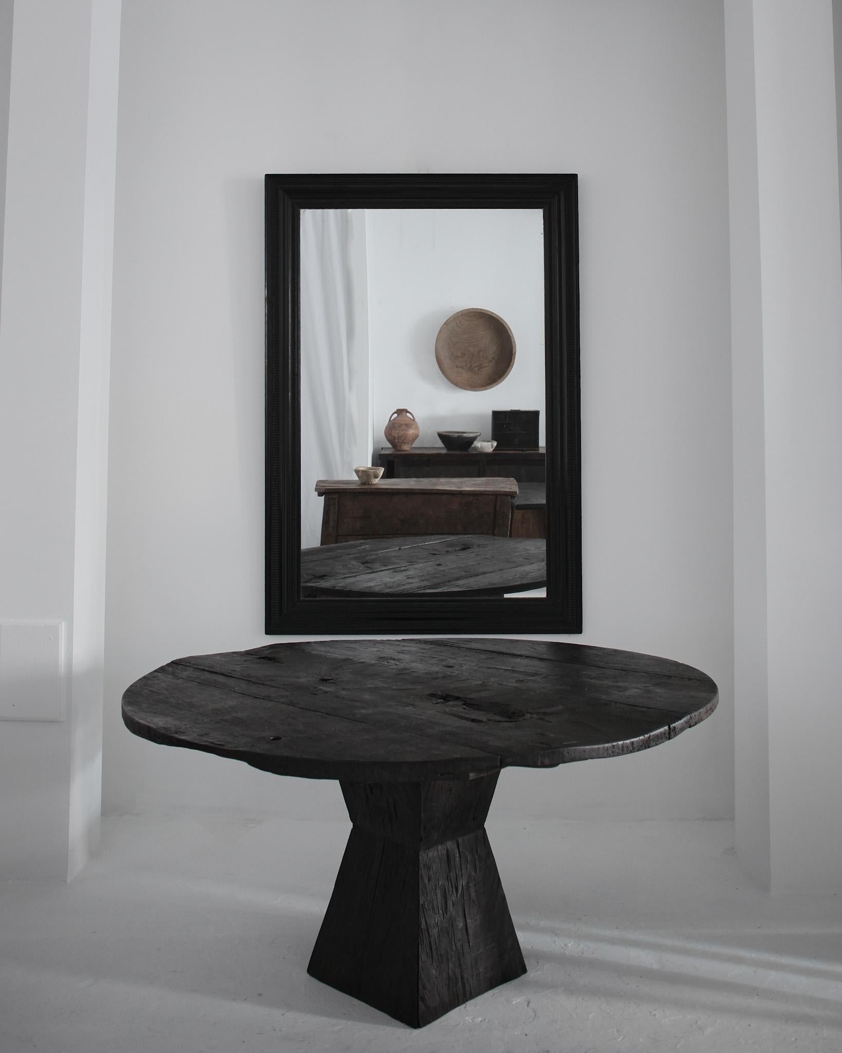 A large circular dinning table made from thick slabs of 19th century Continental beech.

Heavily, Heavily patinated with a dark brown matt wax finish on a Brancusi style base.

-

We offer free shipping to Canada/USA through Fedex with this