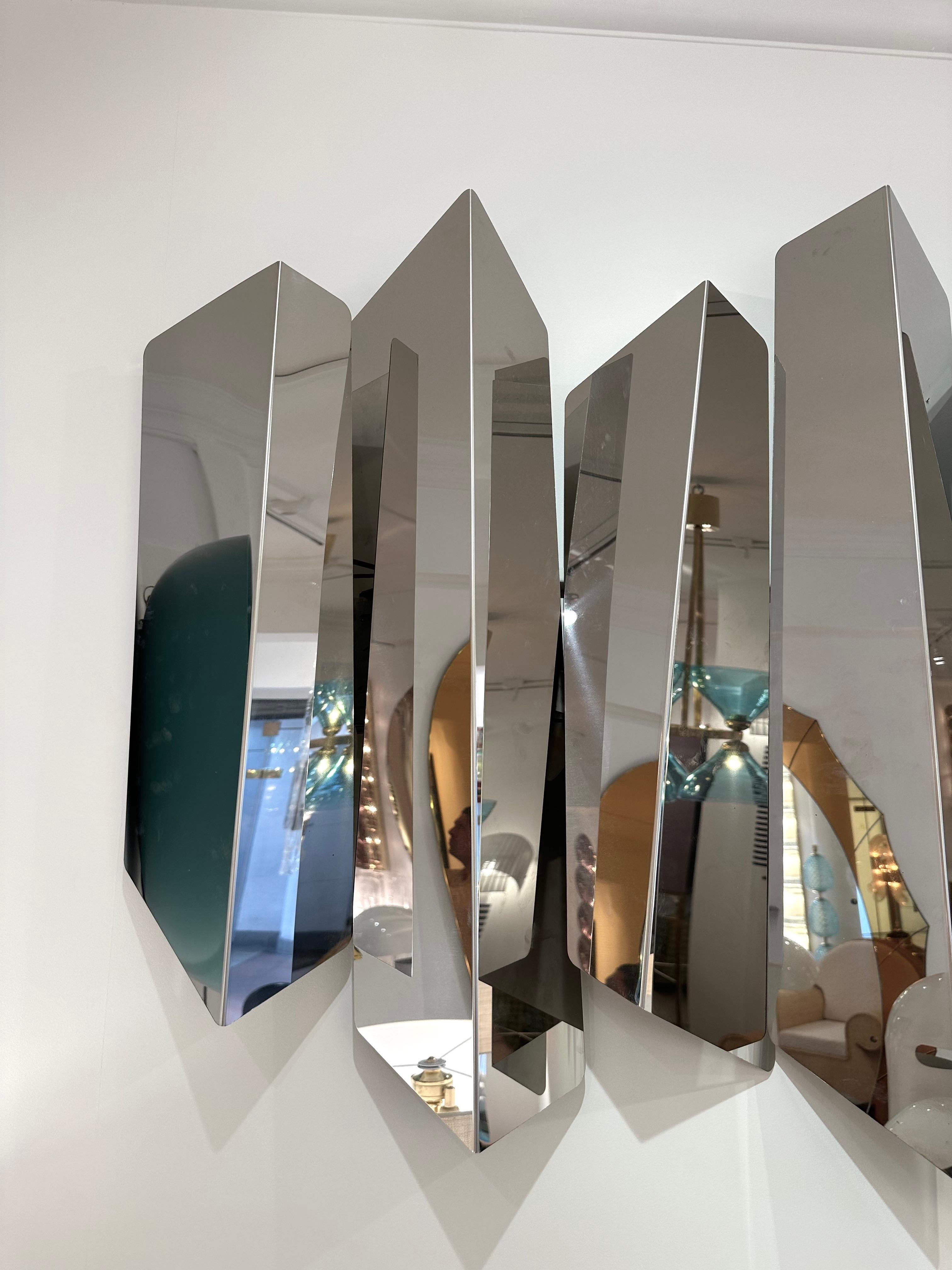Huge impressive and extremely decorative sculpture sconce or wall light lamp lightning panel by the designer Mario Torregiani. Each blade of polished stainless steel are retro light by ten bulbs. Famous like Aldo Nason, Poliarte, Esperia, Angelo