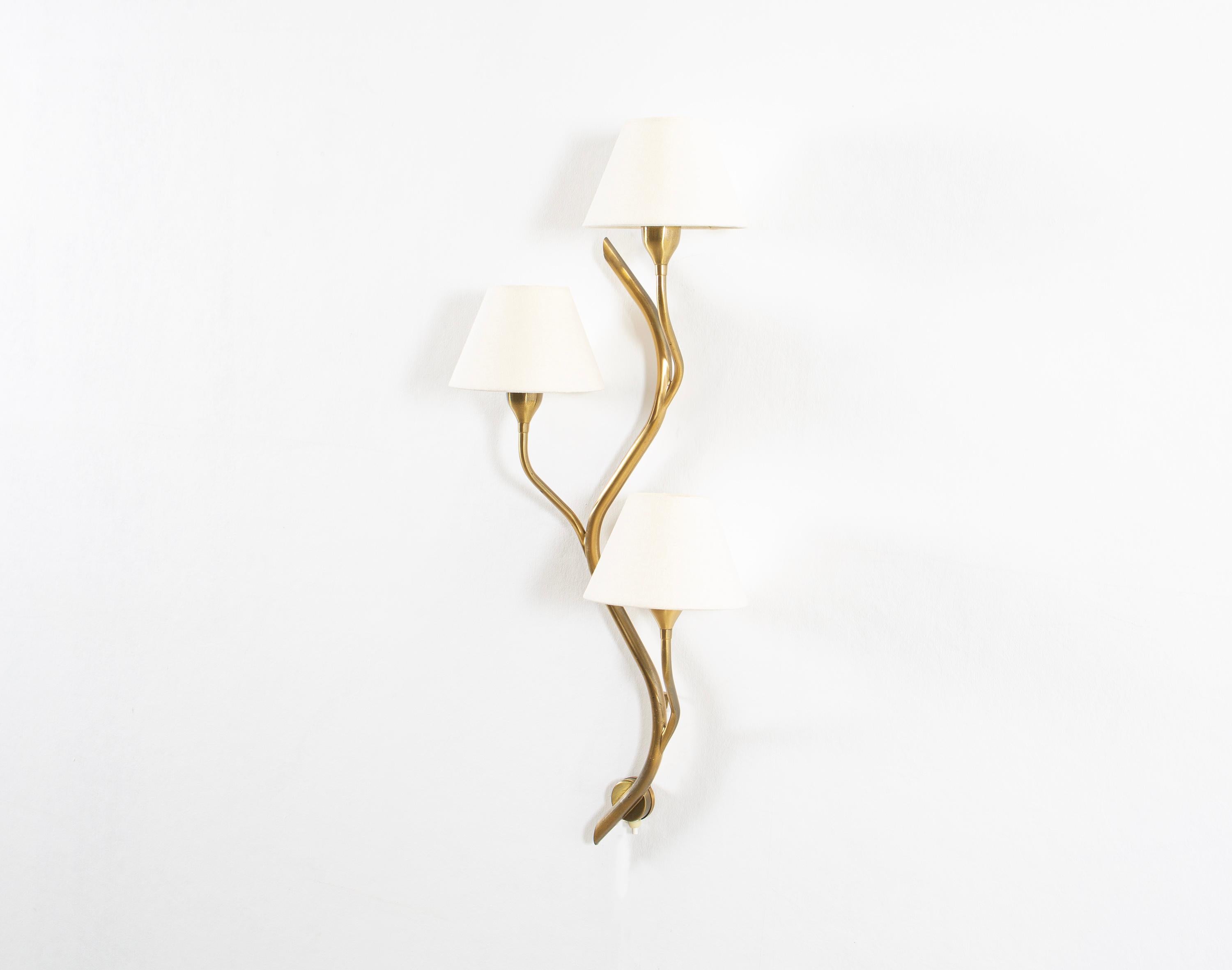 Sculptural and organically shaped wall lamp in brass. The lamp is designed and made in Norway by Astra from circa 1960s second half. The lamp is fully working and in good vintage condition. It is fitted with three E27 bulbs (works in the US), with a