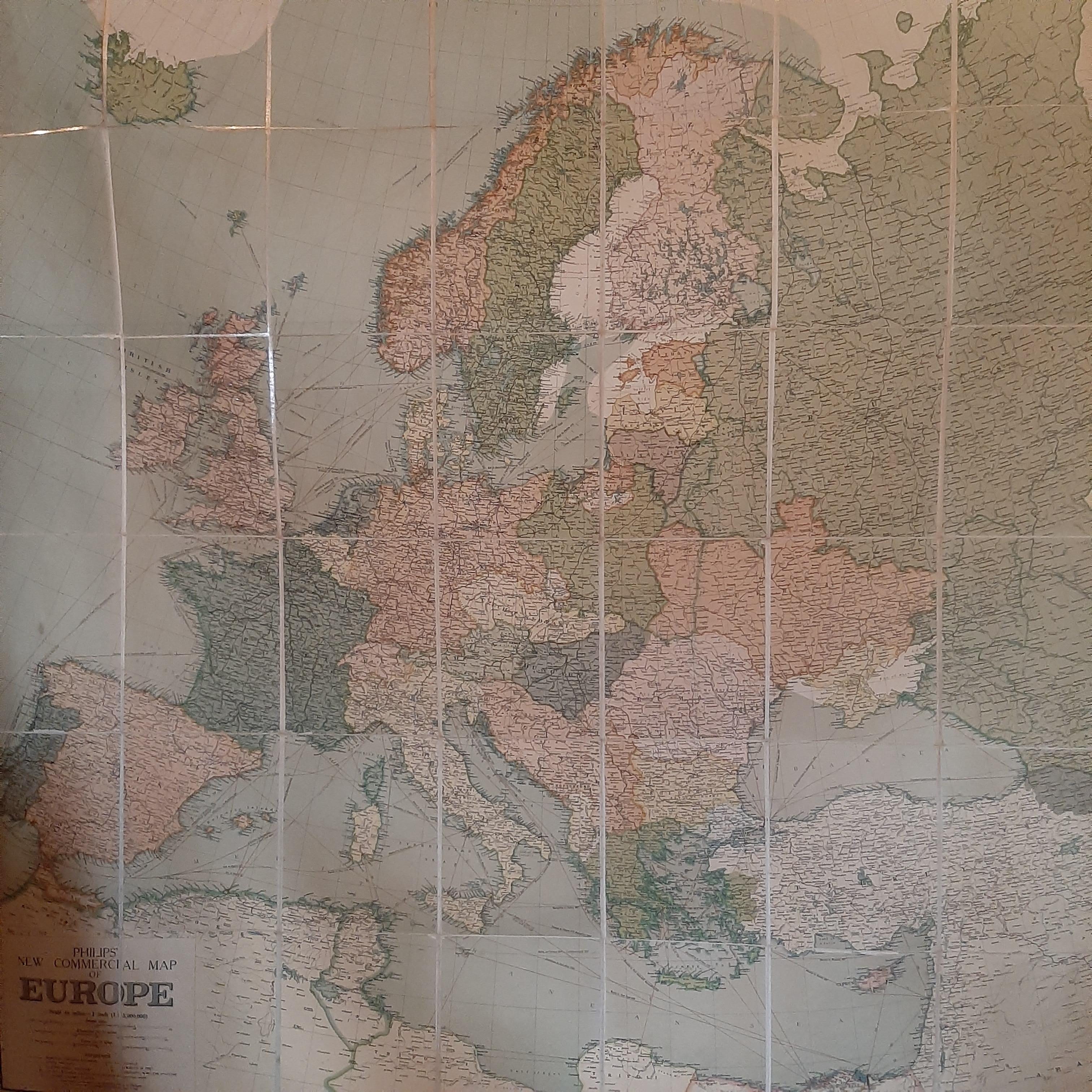 Antique map titled 'Philips' New Commercial Map of Europe'. Very large wall map of Europe including the North African coast and Turkey. Decorative borders. Dissected into 48 segments and mounted on linen, folding into original boards. Published by