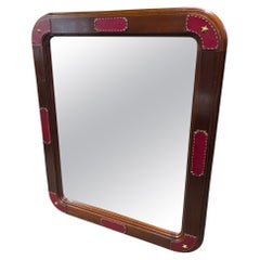 Large wall mirror with stitched leather by Jacques Adnet