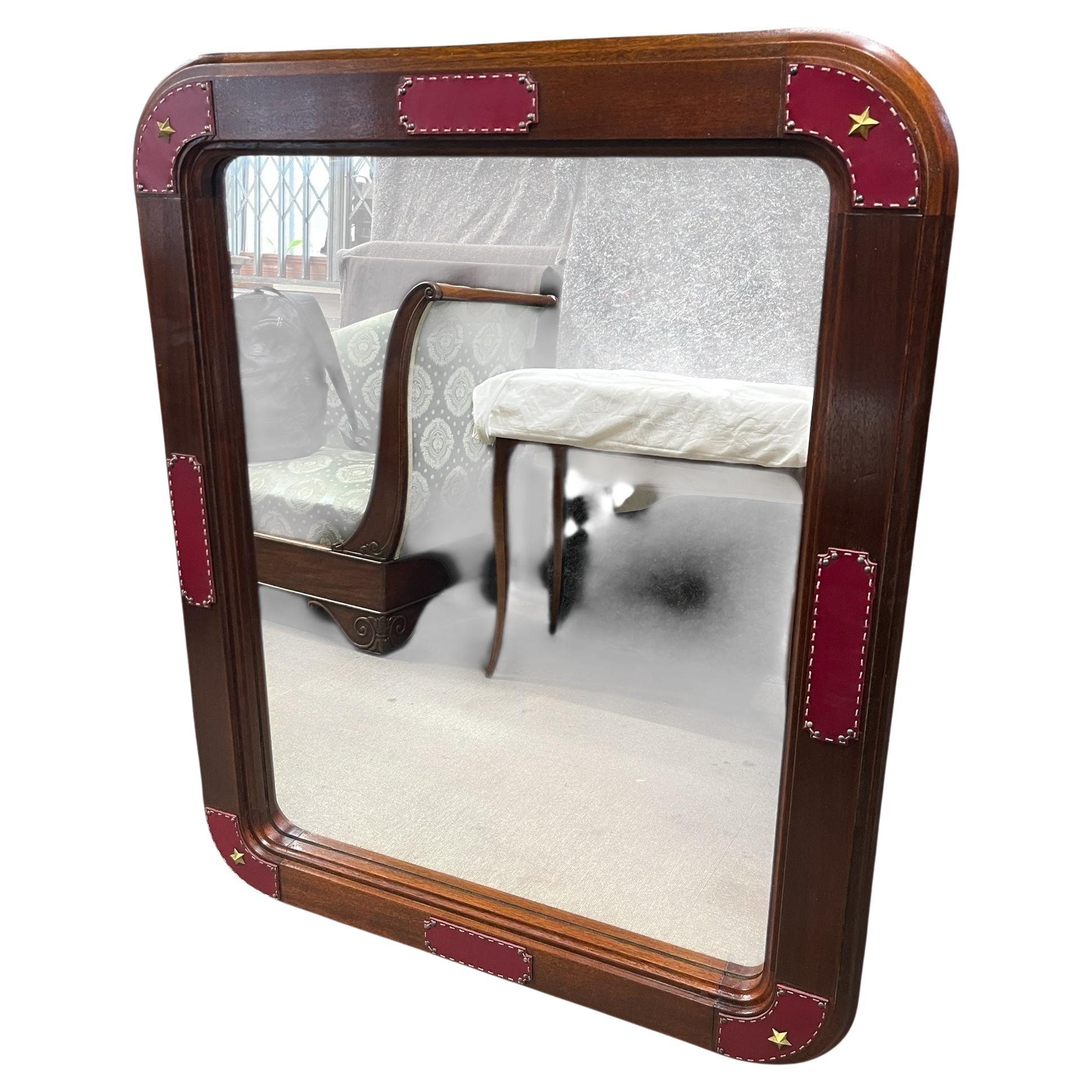 Large wall mirror with stitched leather by Jacques Adnet en vente