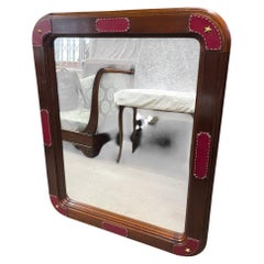 Large wall mirror with stitched leather by Jacques Adnet
