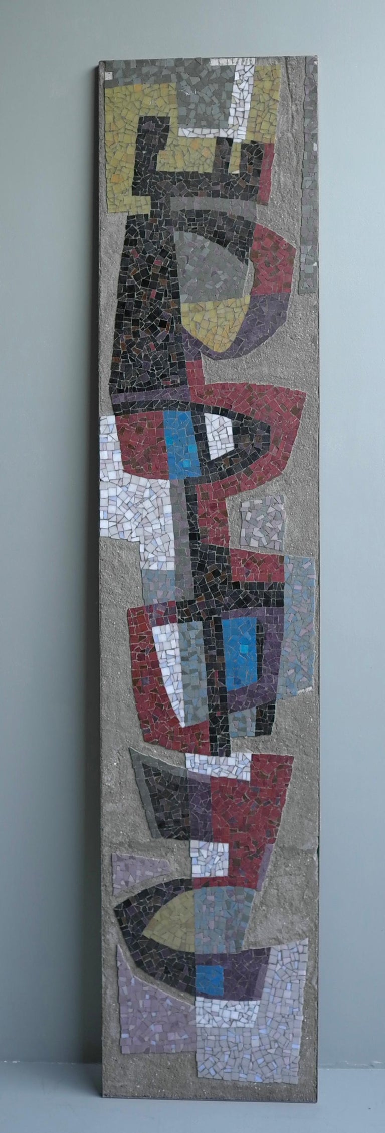 Large wall-mounted sculpture colored stone in concrete Mid-Century Modern, 1952

This wall Sculpture was taken out of a building by Dutch Architect Jan Duiker. It should be made circa 1952, the sculpture is signed with ACK. Jan Duiker (also