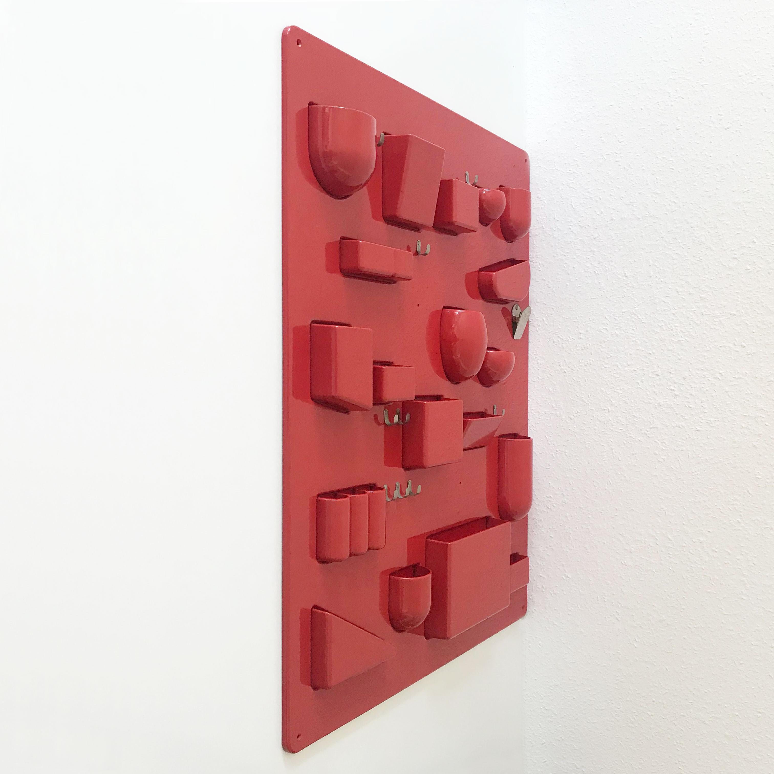 Exceptional Mid-Century Modern wall organizer Uten.Silo I, designed by Dorothee Becker in 1969. Manufactured in 1970s by Design M, Ingo Maurer, Munich, Germany.
This is the large version.

The Uten.Silo I is executed in tomato red ABS plastic and