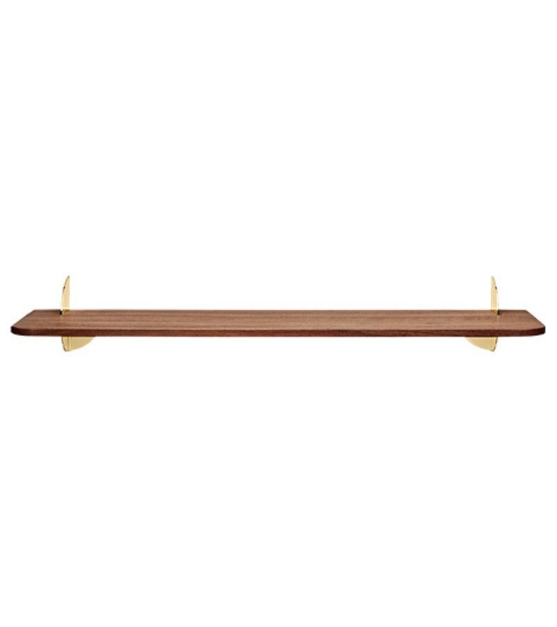 Large walnut and steel minimalist shelf 
Dimensions: L 80 x W 18 x H 12 cm 
Materials: Steel W. powder coating, brass plating & walnut MDF.
Also available in black ash MDF and size small.

Simplicity always seems to make the most sense. The new