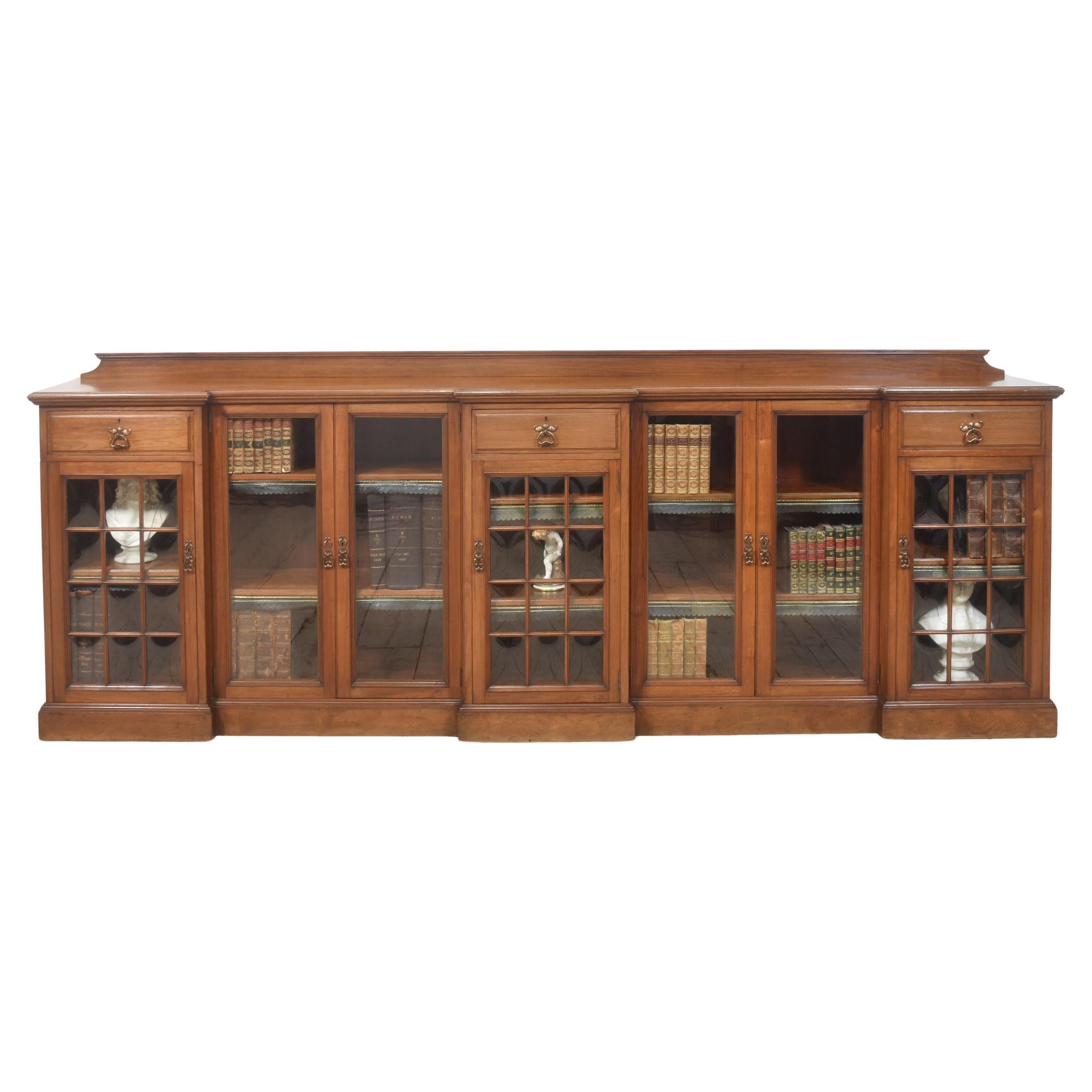 Large walnut breakfront low bookcase