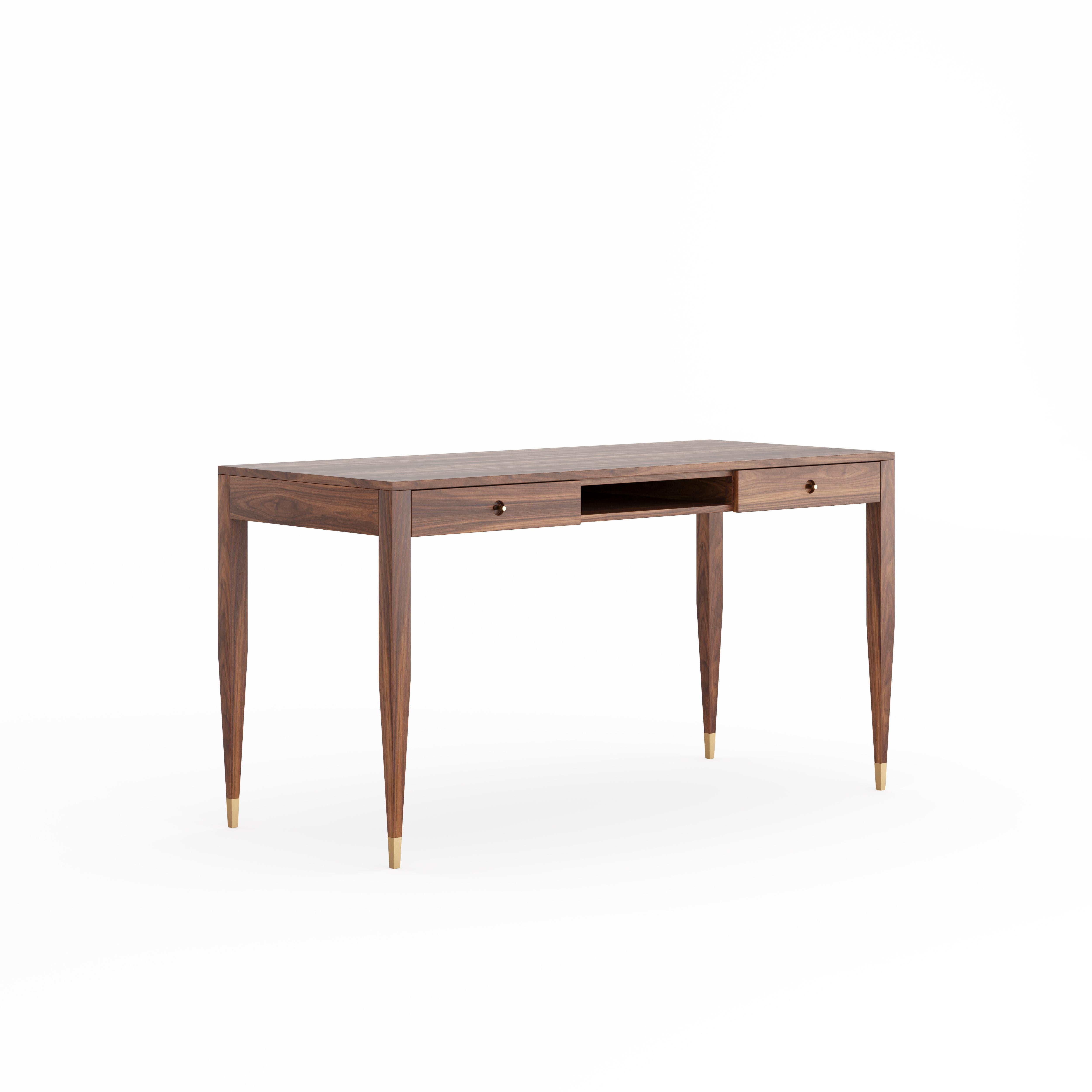 Large walnut desk in mid-century style with two drawers, shelf and brass handles. The tapered legs are finished with brass plated aluminum feet. Desk made of solid American walnut wood and wood covered with natural American walnut veneer. Other wood