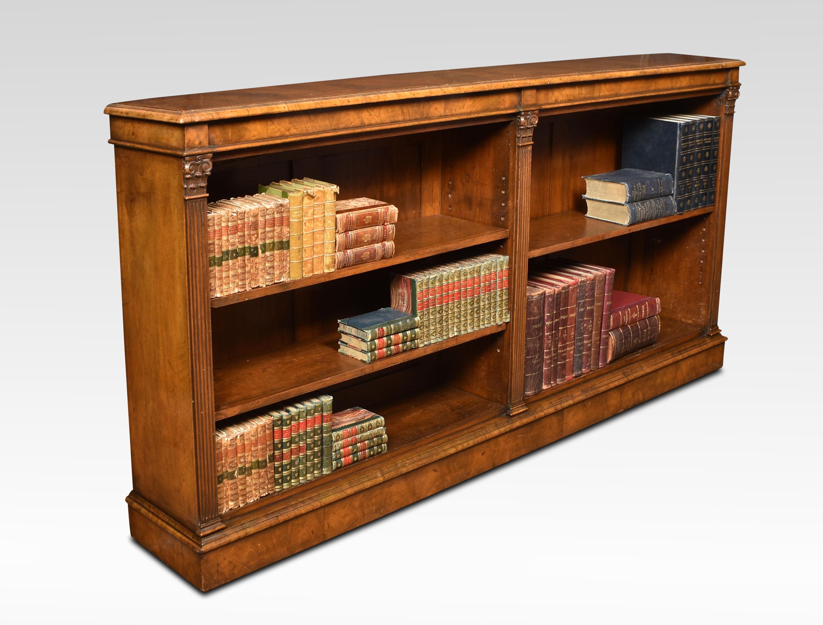 Walnut open bookcase, the large impressive rectangular top. Above two bays of adjustable shelves divided by scrolling capped redded columns. All raised up on plinth base.
Dimensions
Height 40 Inches
Width 89 Inches
Depth 13.5 Inches.