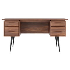 Large walnut office desk with six drawers and black legs in mid century modern