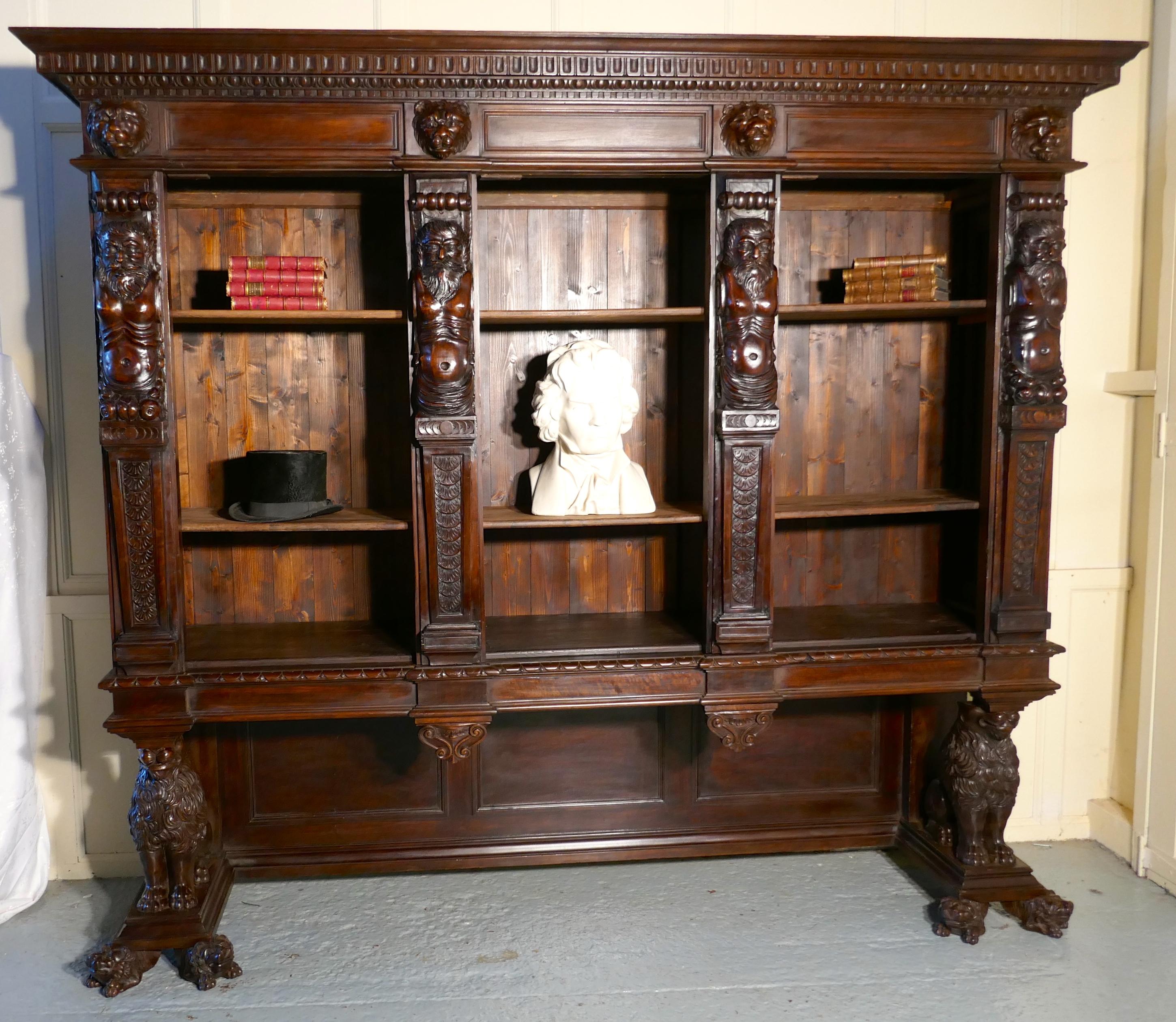Large walnut open bookcase, carved with lion Caryatid and ancient gods

This is a large piece with superb quality carvings. At the bottom, the bookcase is supported at each side by a Caryatid Lion, these are set on plinths supported by lions mask