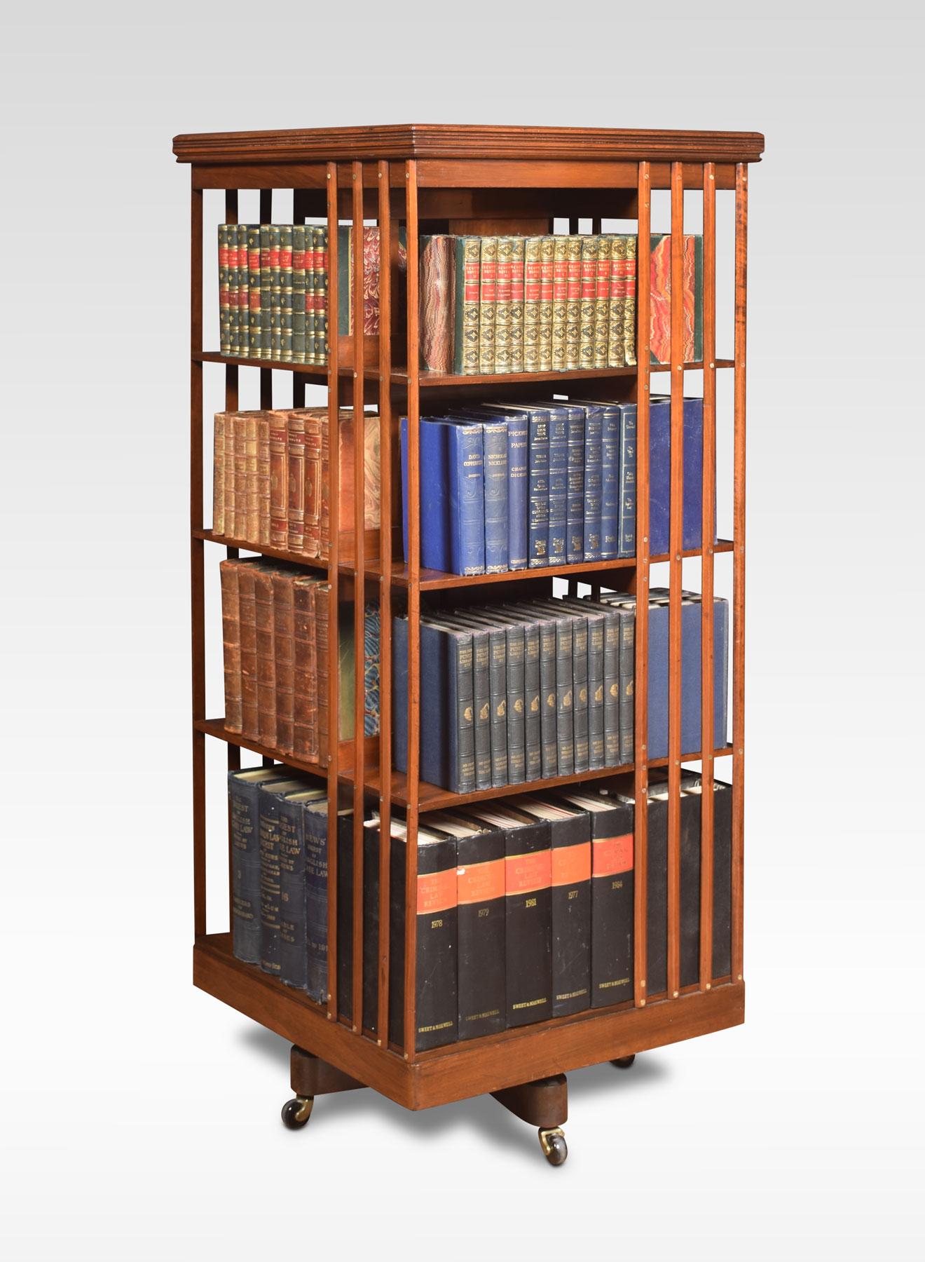 Large walnut revolving bookcase the square moulded top above four tiers with an arrangement of shelves raised up on metal cruciform base terminating in ceramic castors.
Dimensions
Height 53.5 inches
Length 23.5 inches
Width 23.5 inches.