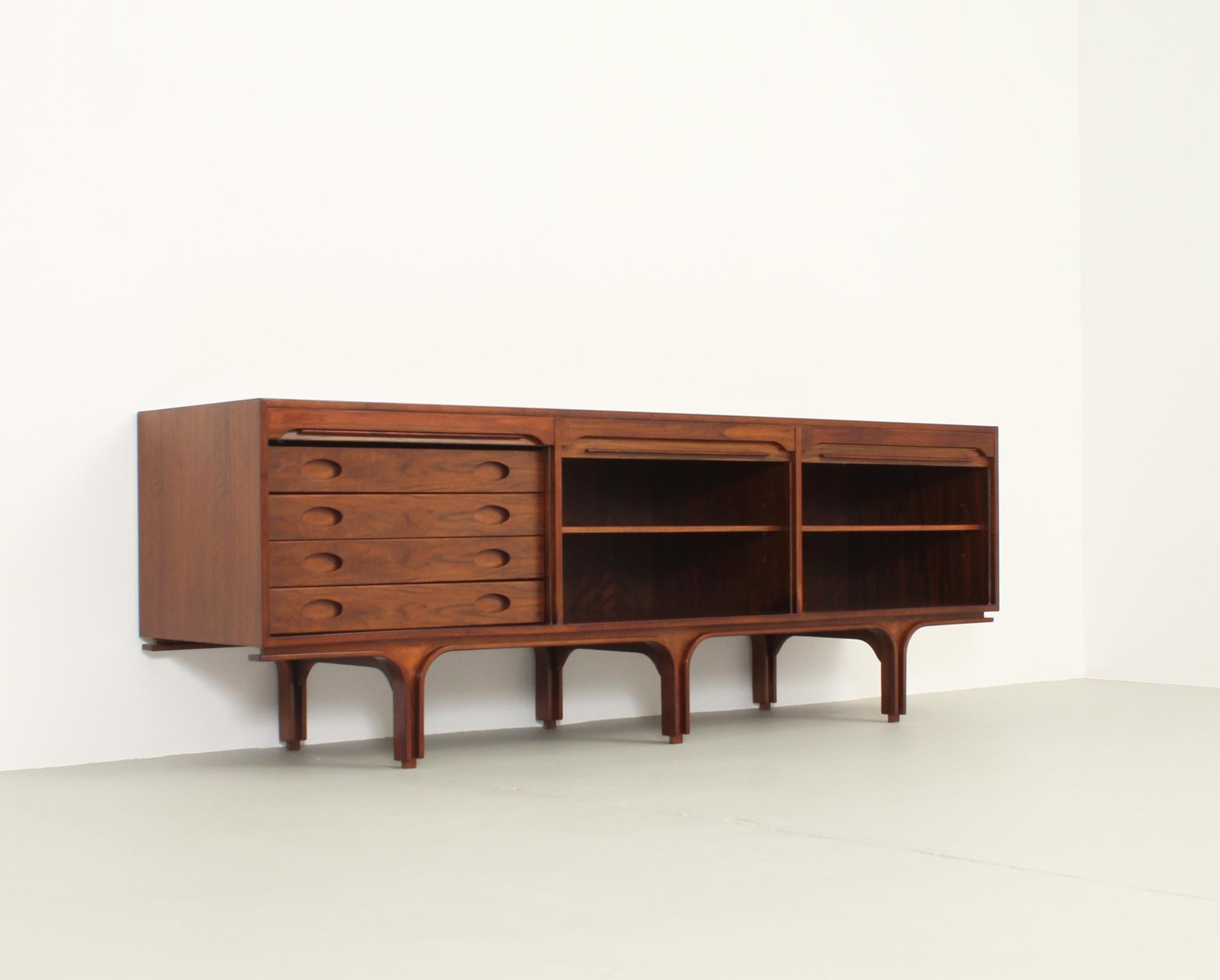 Sideboard with tambour doors designed in 1957 by Gianfranco Frattini for Bernini, Italy. Walnut wood. Four drawers and two spaces with shelves. This sideboard can be matched with another smaller one.