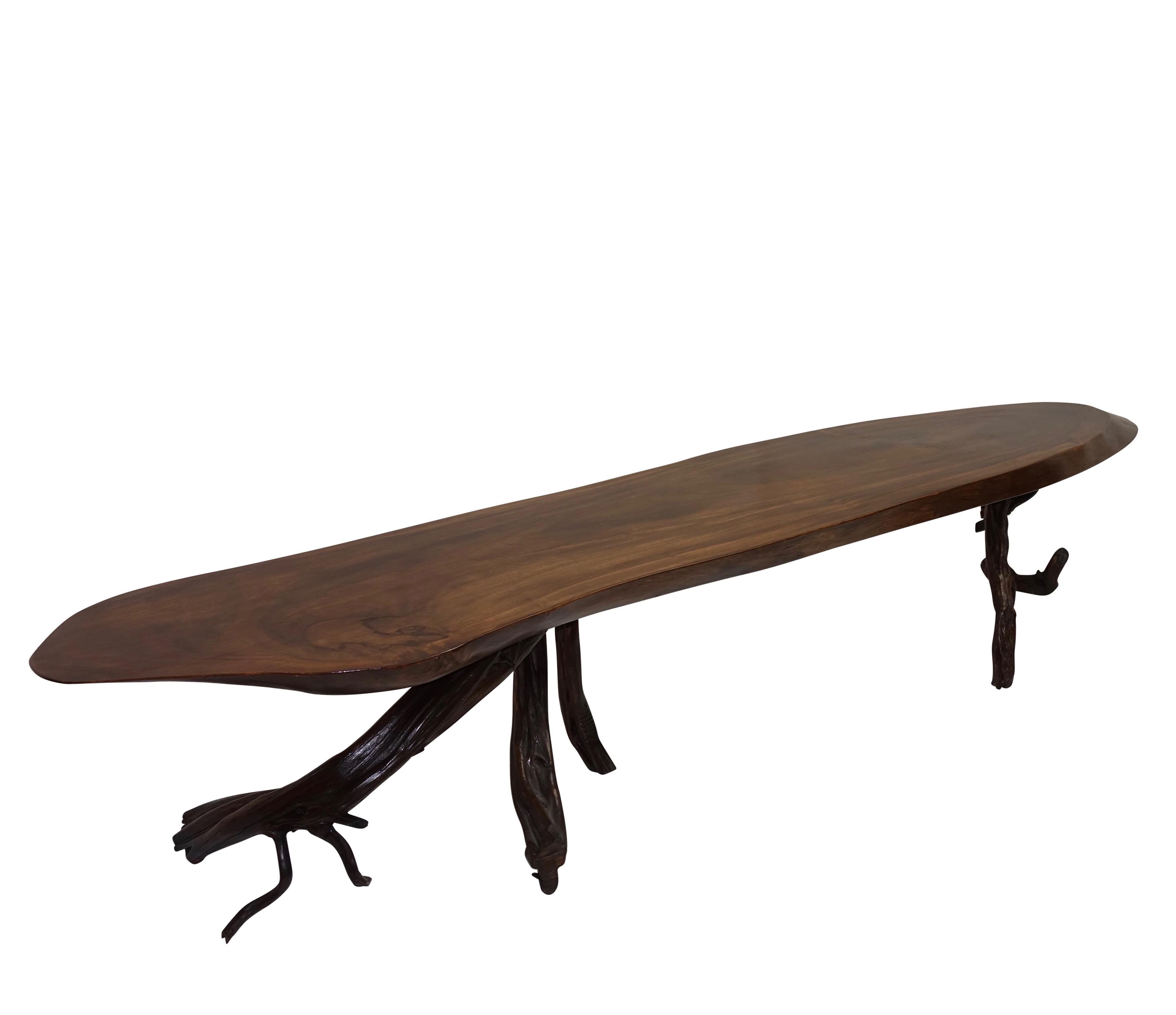 Magnificent and impressive size walnut coffee table with gnarly walnut root legs, American, circa 1970.