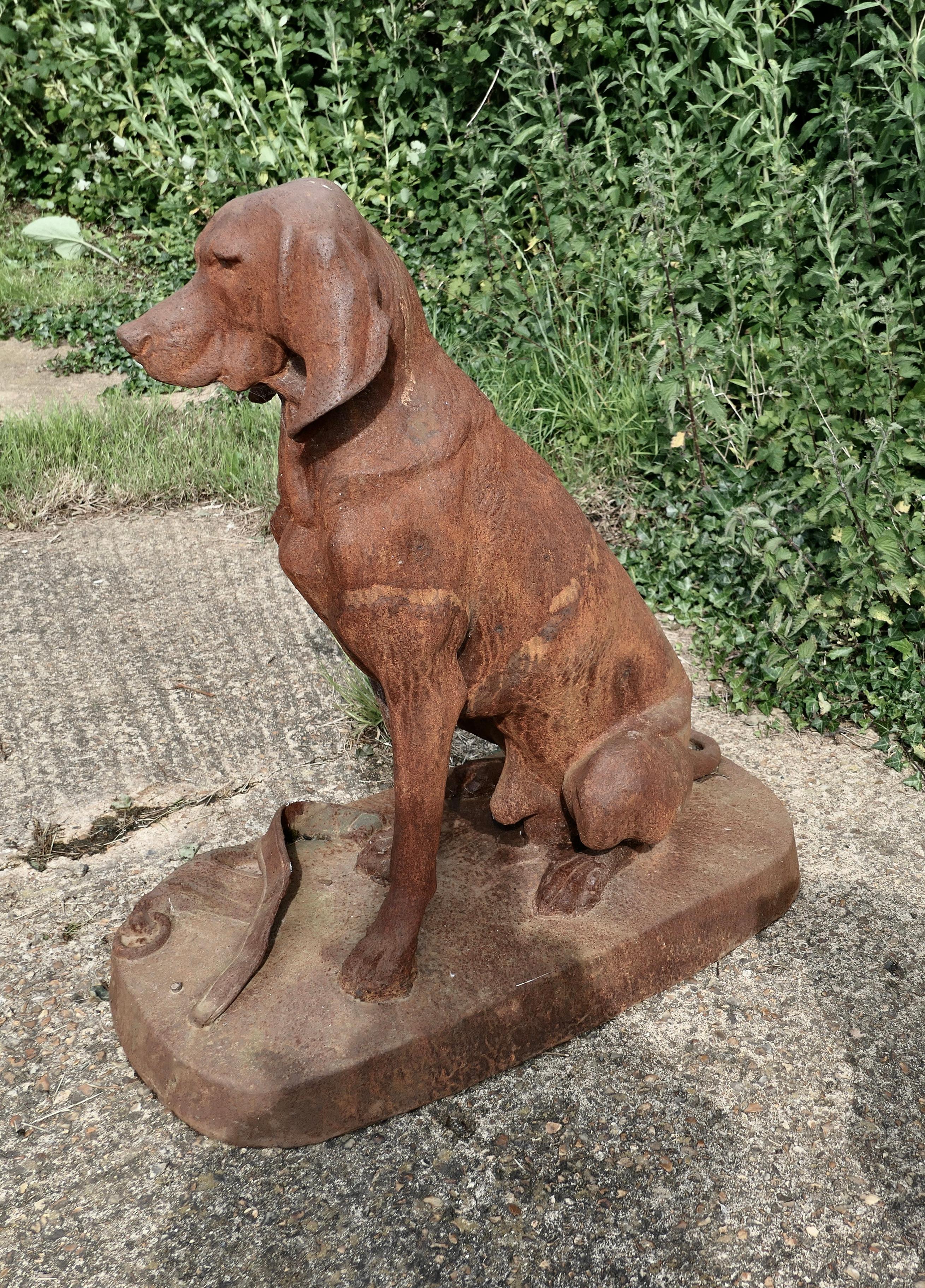 Large weathered cast iron statue of a retriever hunting dog.

A very handsome Chap, he is sitting on a deep plinth he is fully 3 dimensional and looks good from all sides.
Our faithful hound is sitting waiting for the attention of his master with