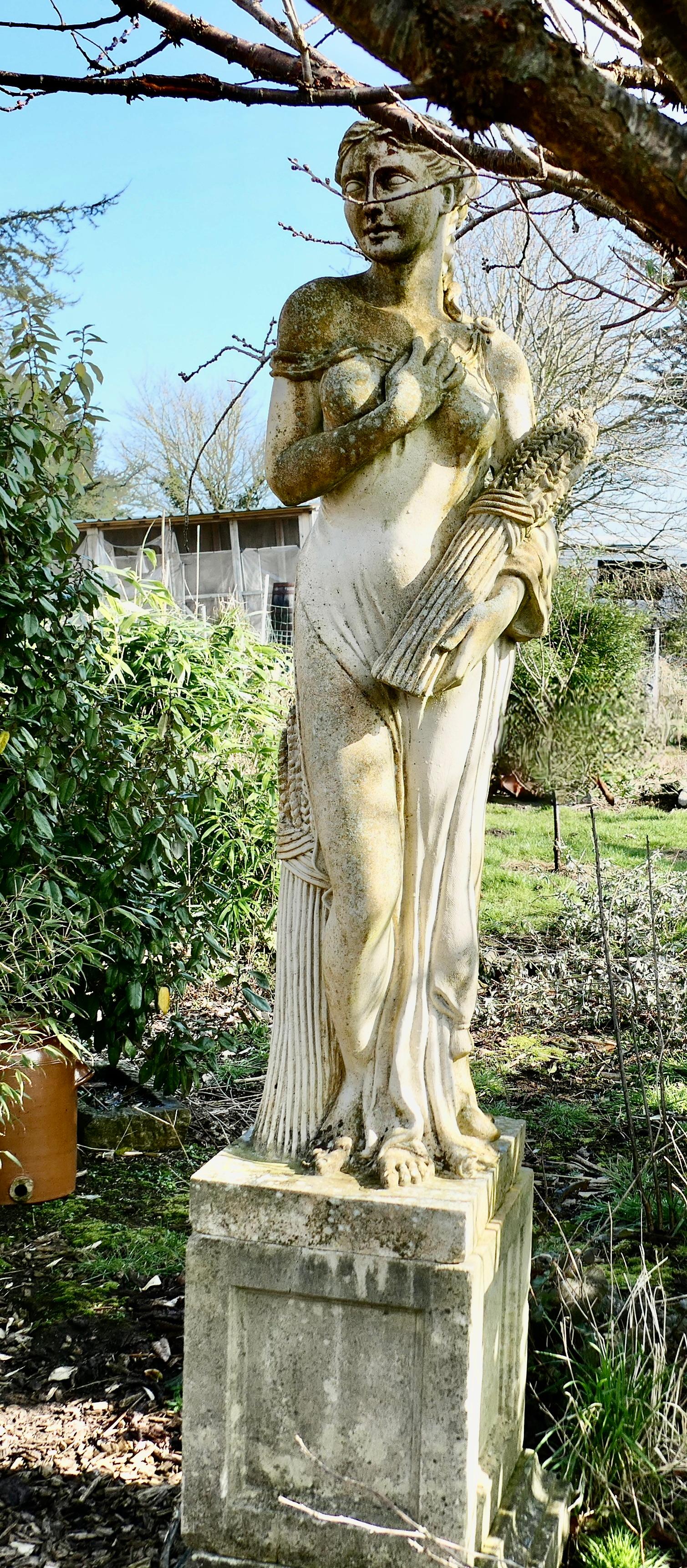 Large Weathered Garden Statue of Autumn of the 4 Seasons

A Large reconstituted stone Statue of Autumn, number 3 of the 4 seasons, she has sheaves of corn to represent the harvest
This is a vintage classical statue, it dates from the early part of