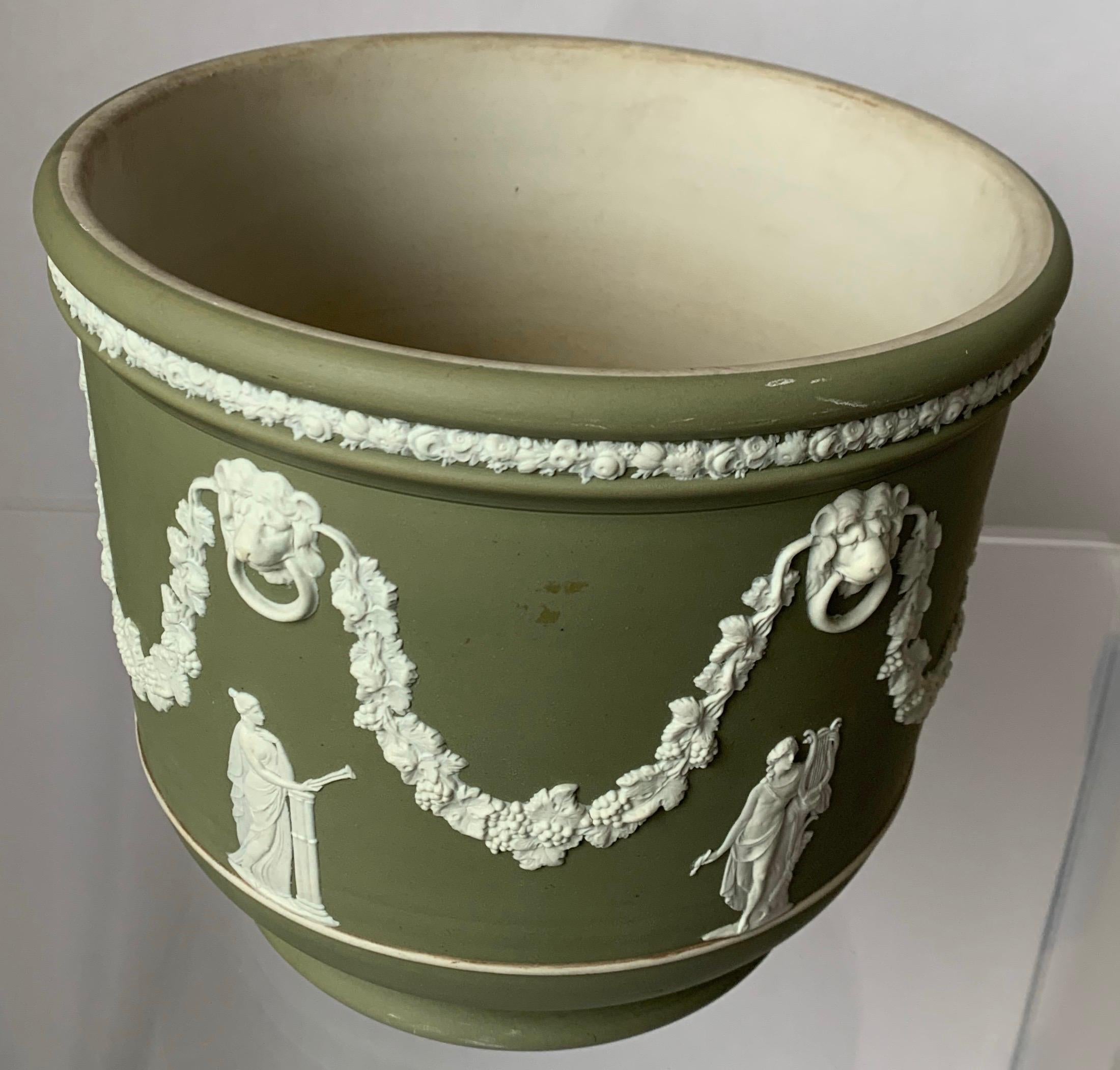 Large Wedgwood light green Jasperware jardinière. All over neoclassical motif. Stamped on the underside.