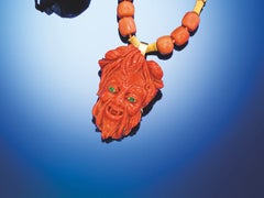 Large Well Carved Coral Happy Devil with Emerald Eyes on a Coral Gold Necklace. Large Well Carved Coral Happy Devil with Emerald Eyes on a Coral Gold Necklace.