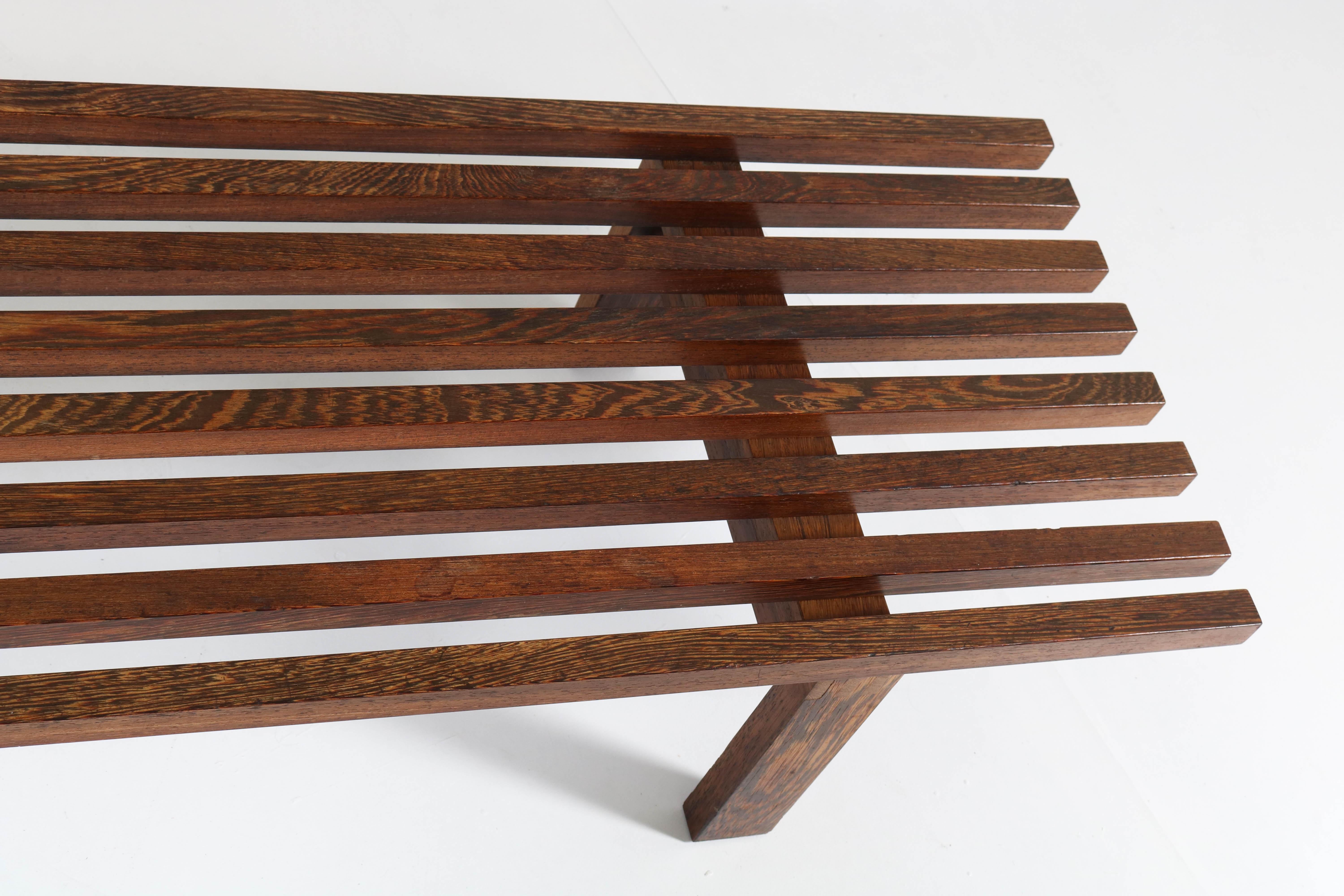 Large wenge Mid-Century Modern slat bench.
Design by Martin Visser for 't Spectrum.
Striking Dutch design from the sixties.
In good original condition with minor wear consistent with age and use,
preserving a beautiful patina.
 