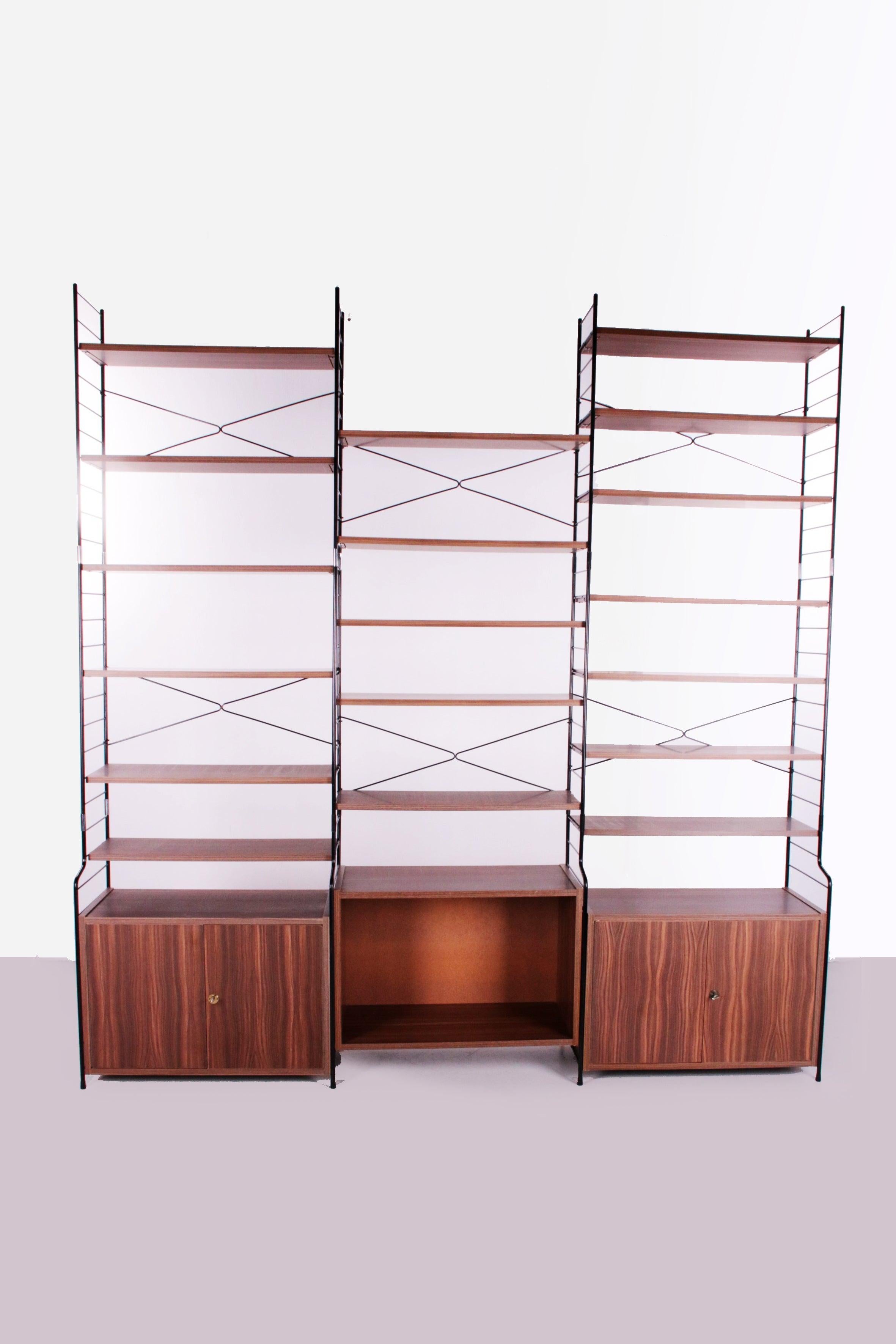 Large WHB Vintage Wall unit or string bookcase 1960 Germany


A beautiful large vintage WHB regal wall unit in walnut veneer, dating from the 1960s.

The condition is excellent for its age, few signs of wear visible,

The wood has a beautiful color